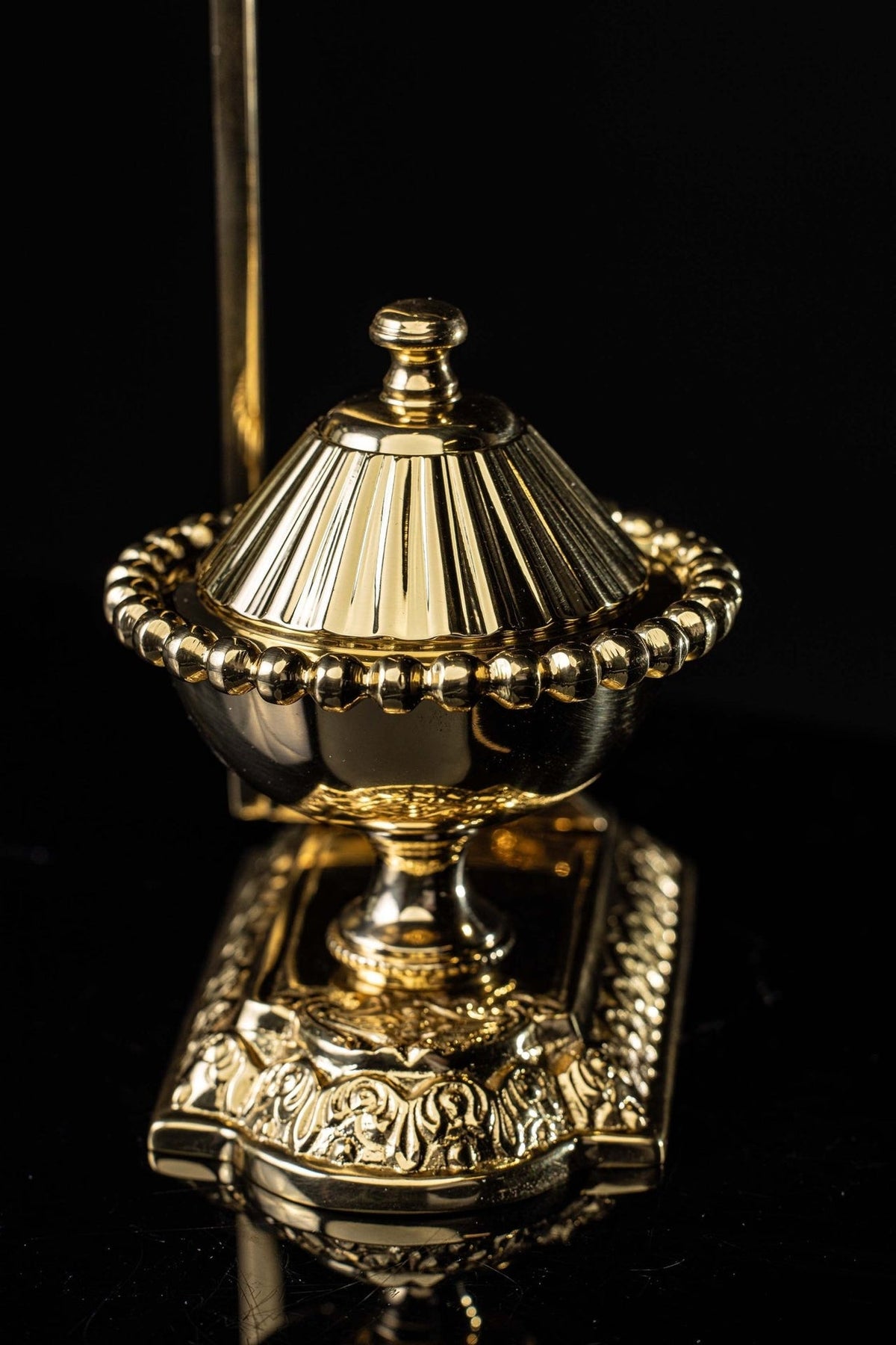 Purificator holder detail showing the ornate pedestal and beaded bowl rim