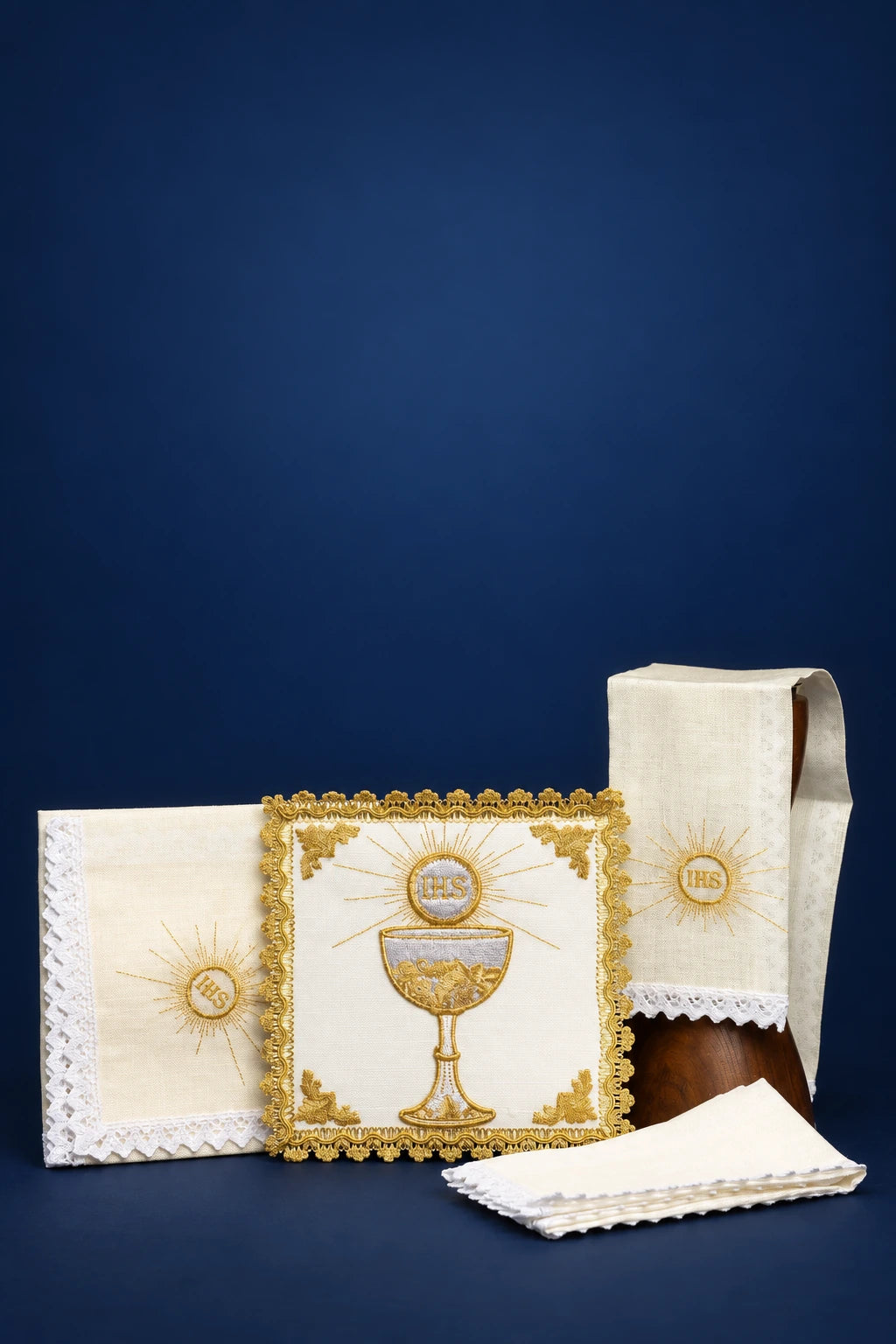 Altar linen set with chalice and IHS embroidery, shown with corporal, purificator, and pall folded and displayed