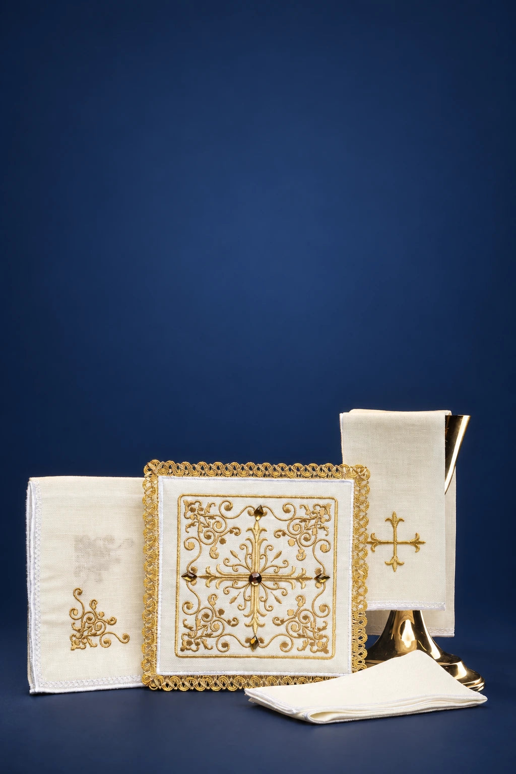 Altar linen set with gold cross embroidery and ornate lace-trimmed square cloths