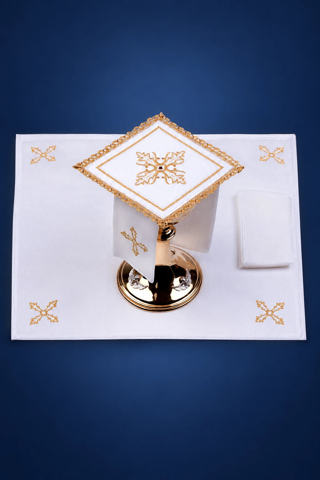Altar linen set with gold cross embroidery, shown laid flat with matching chalice veil and folded cloth