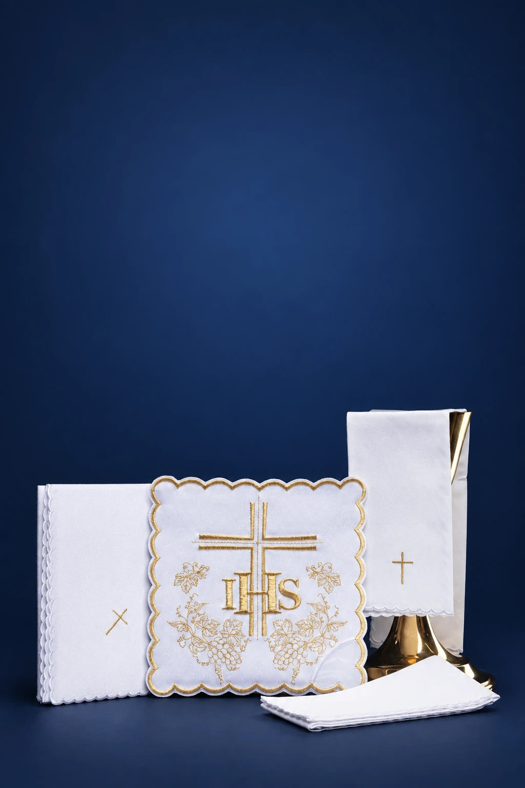 Altar linen set with gold cross and IHS embroidery, shown with folded linens and burse