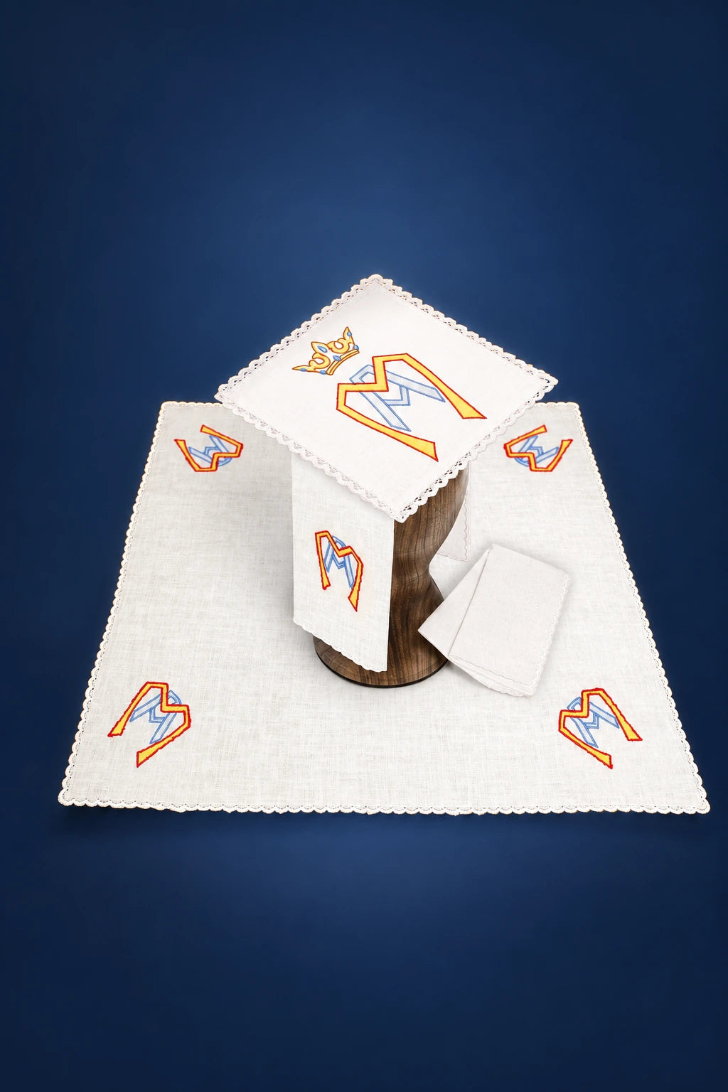 Altar linen set with scalloped edges and Marian monogram embroidery on the corporal and cloths