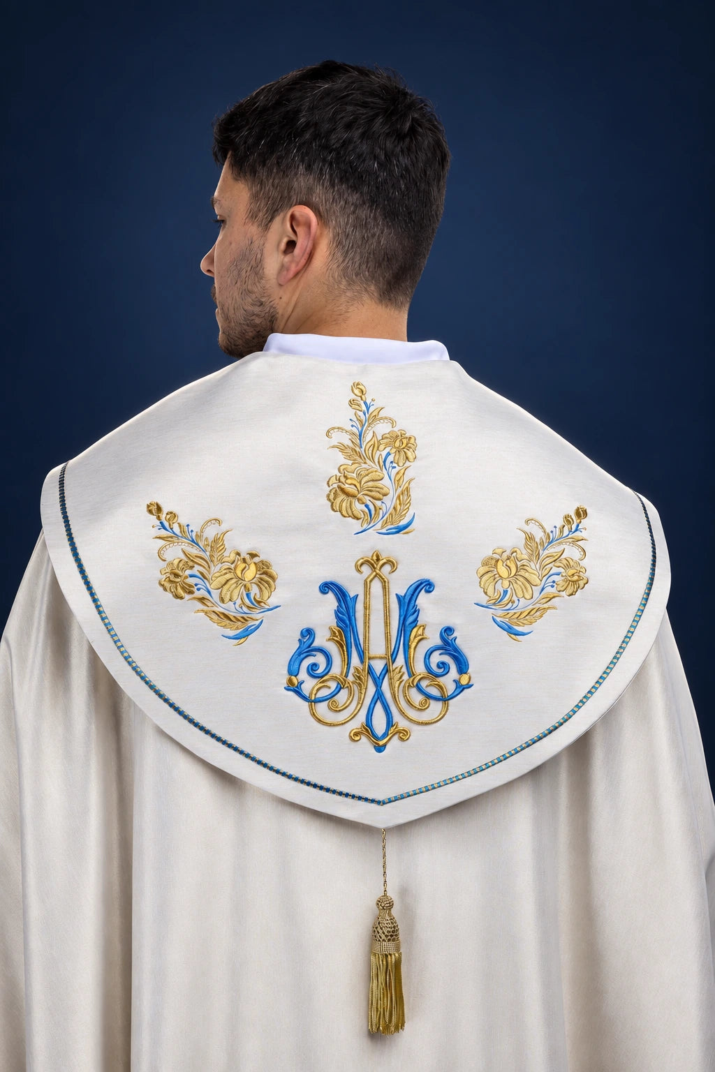Back view of an ecru cope with Marian embroidery and tassel trim