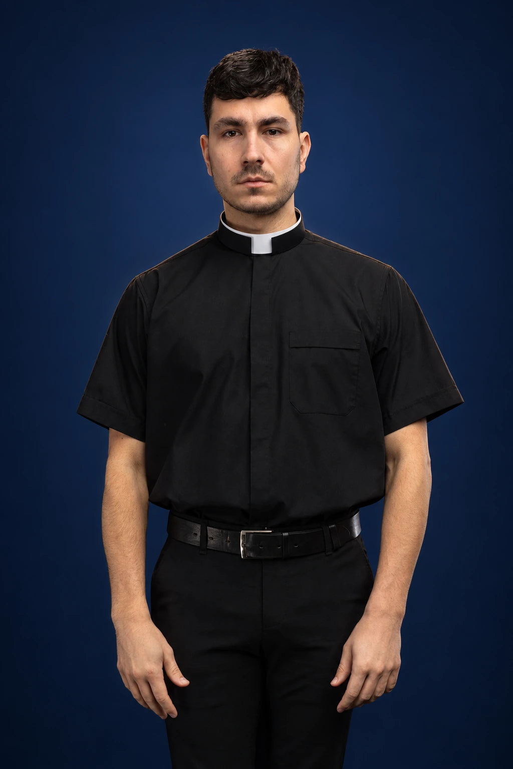 Black short-sleeve clergy shirt with Roman collar, front view, relaxed fit and chest pocket