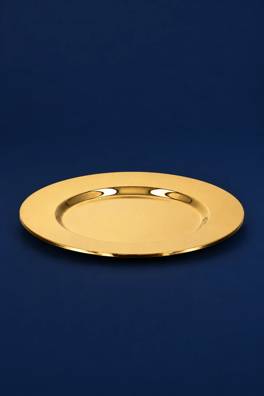 Brass communion paten, top view, with smooth shallow raised rim and polished gold finish