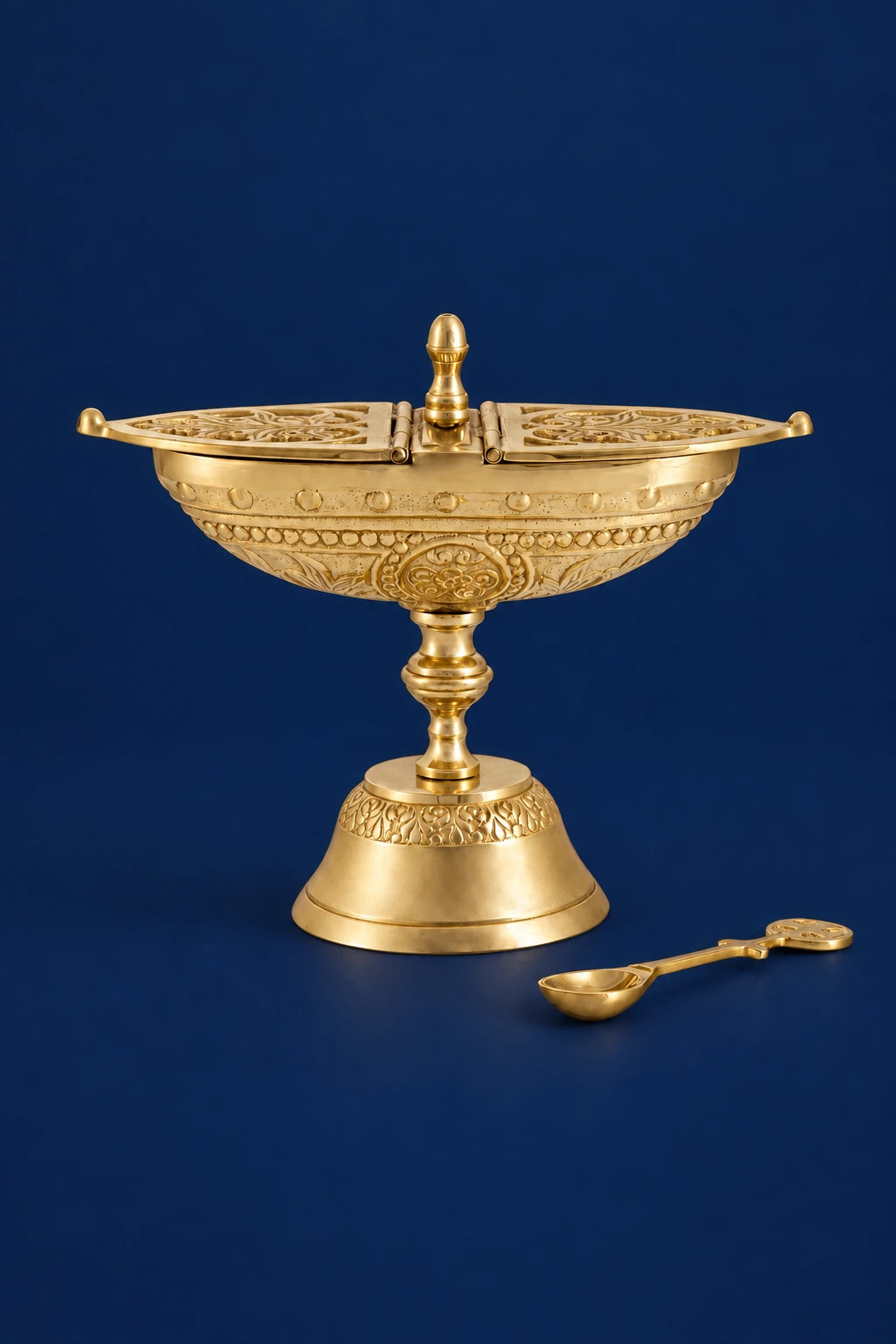 Brass incense boat on pedestal with matching spoon, engraved lid and decorative banding, front view