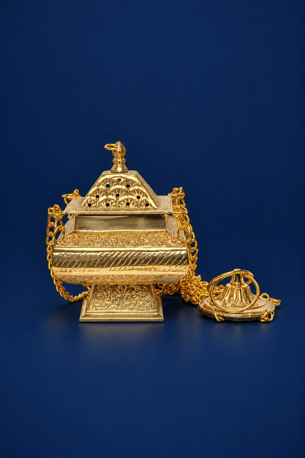 Brass Thurible, front view with ornate floral engraving, perforated lid and attached chains