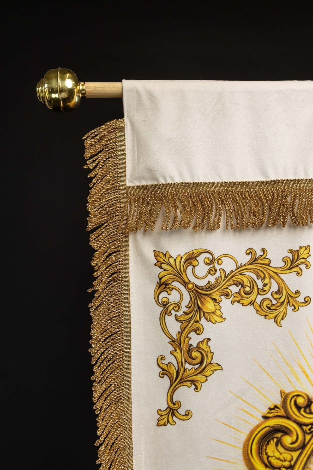 Church banner upper corner showing gold fringe and scrollwork