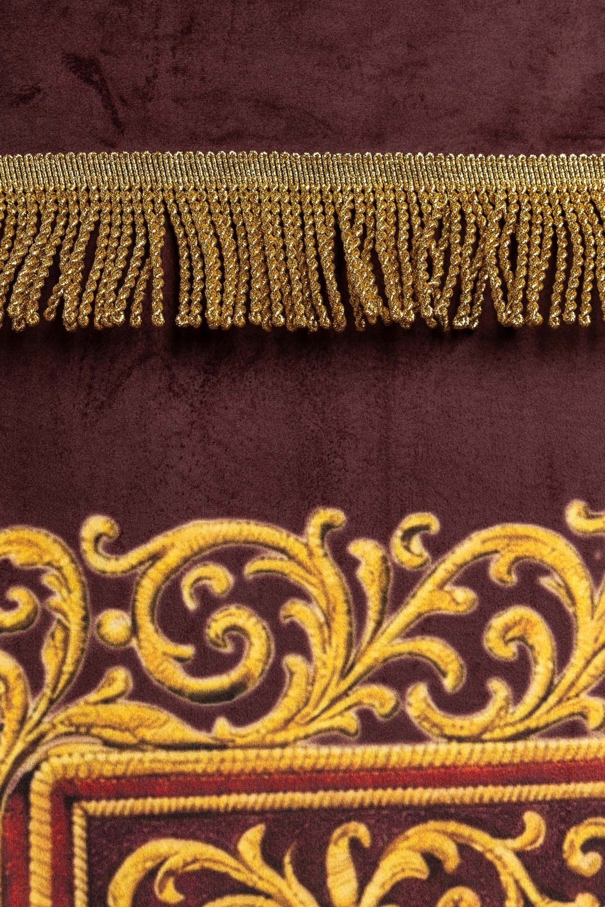 Church banner close-up showing gold fringe and burgundy printed fabric