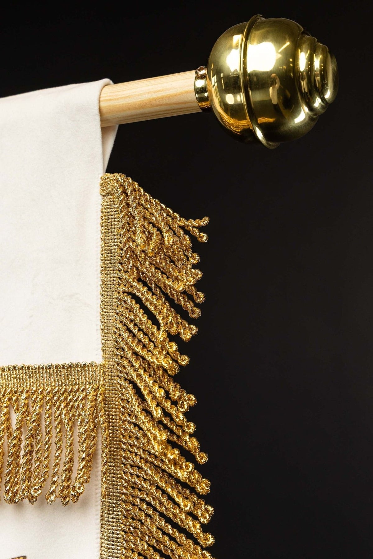Church banner side detail with gold fringe and finial