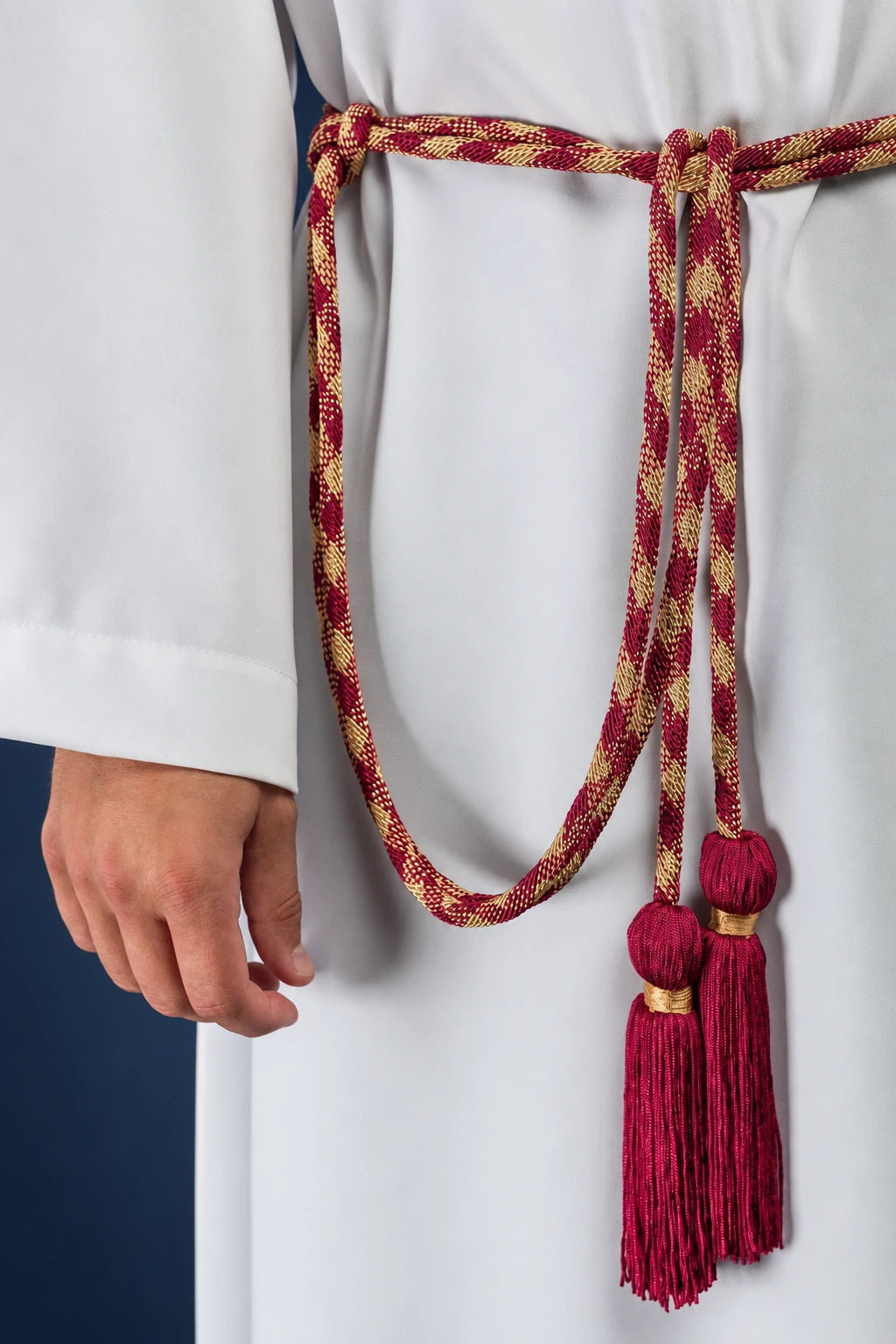 Premium Red-and-Gold Liturgical Cincture worn with red tassels and gold woven motifs