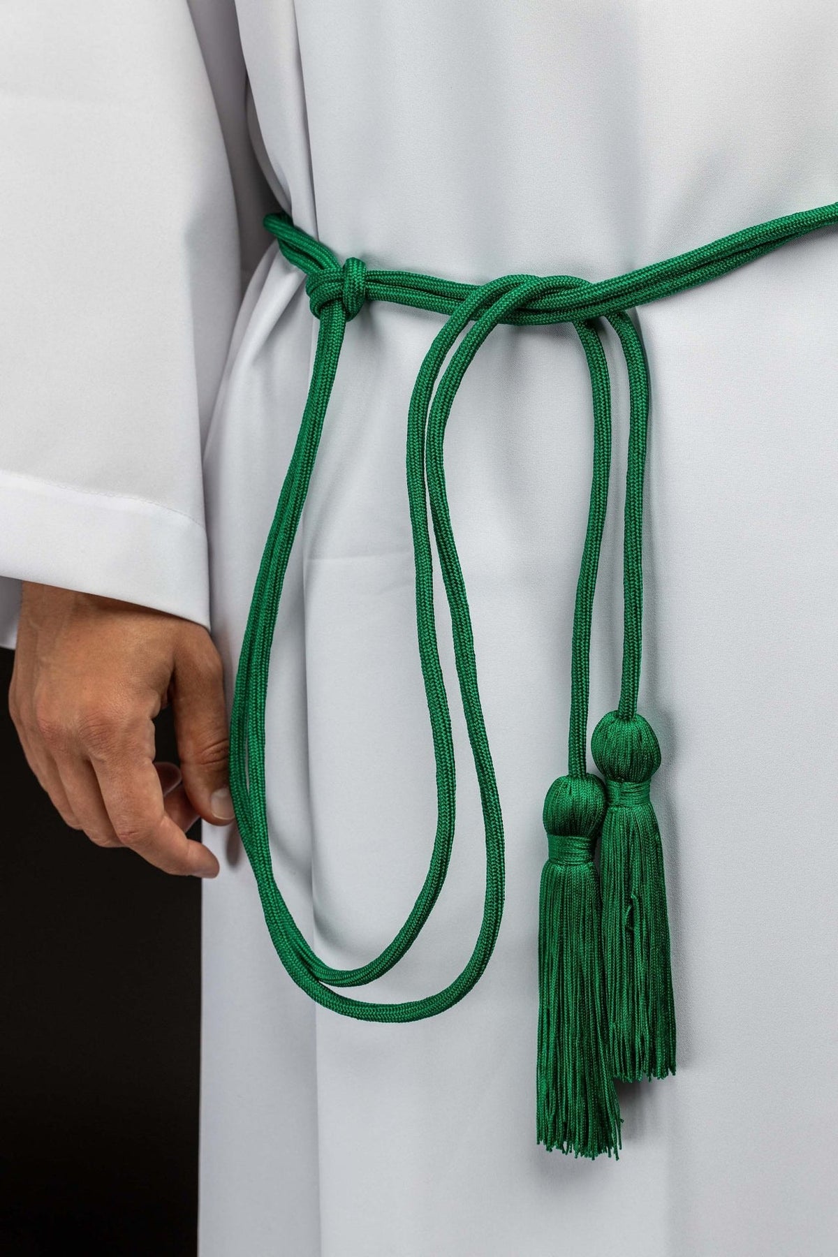 Green cincture front view with hanging cord loops and tassels