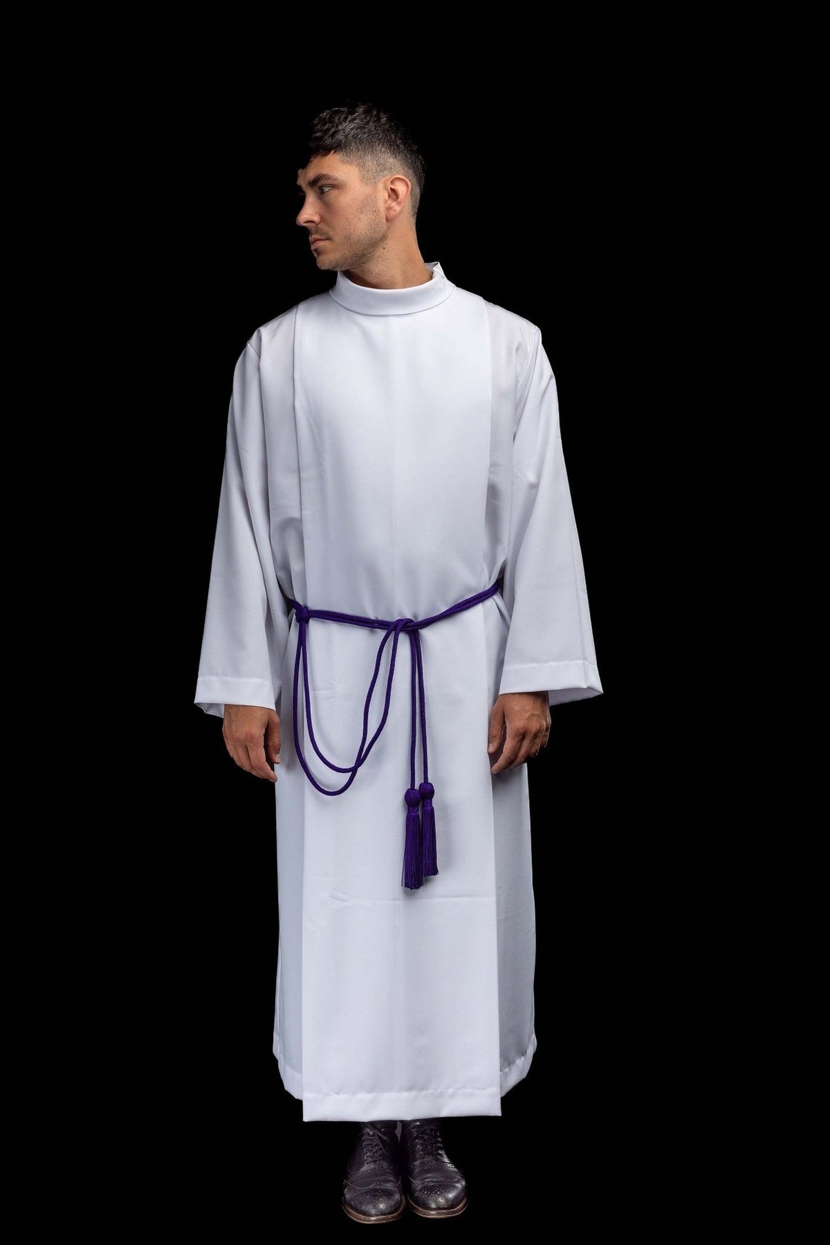 Purple cincture worn over an alb, full front view