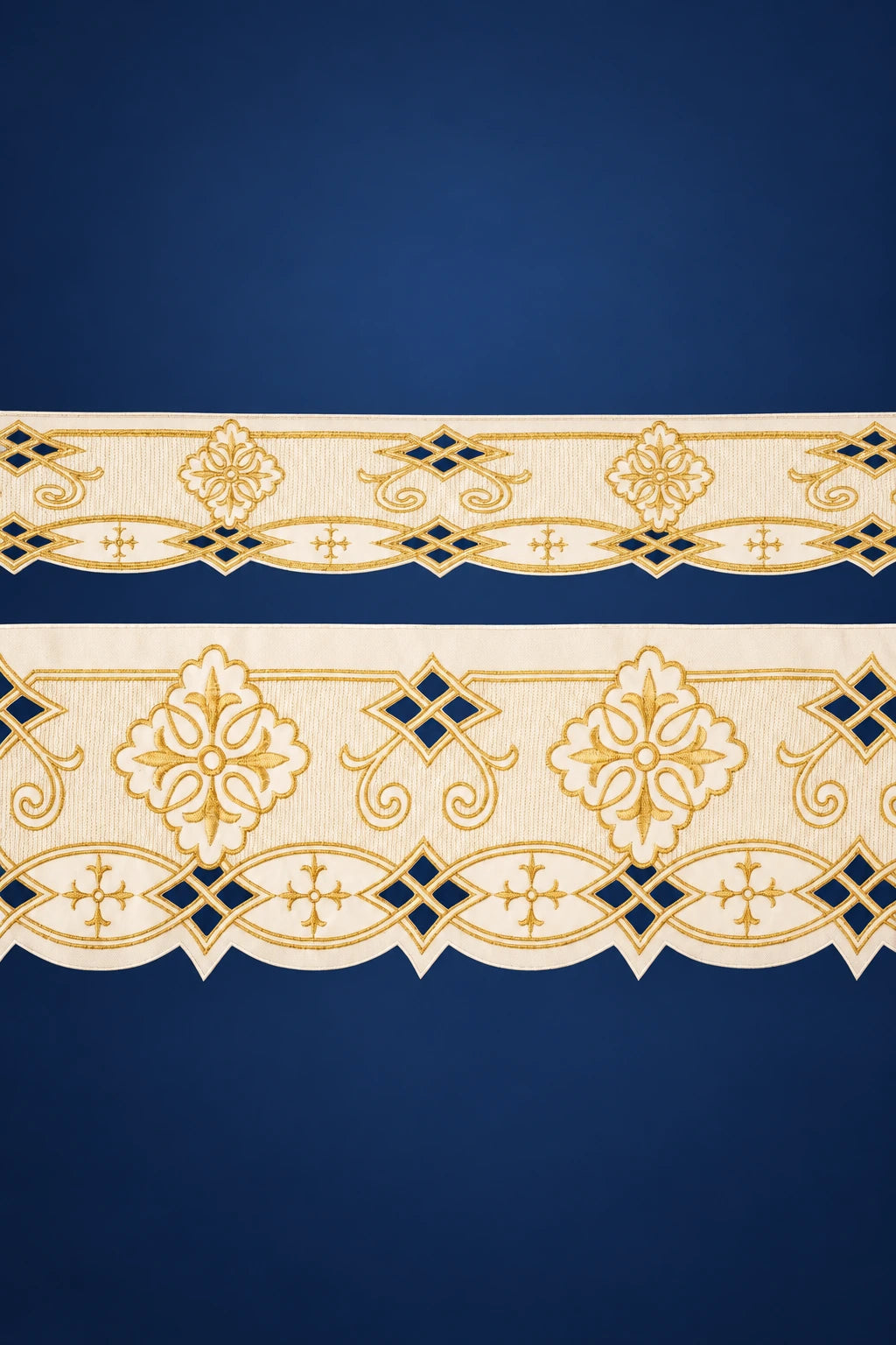 Close-up of ecru altar lace with gold and blue roseta embroidery and scalloped edge