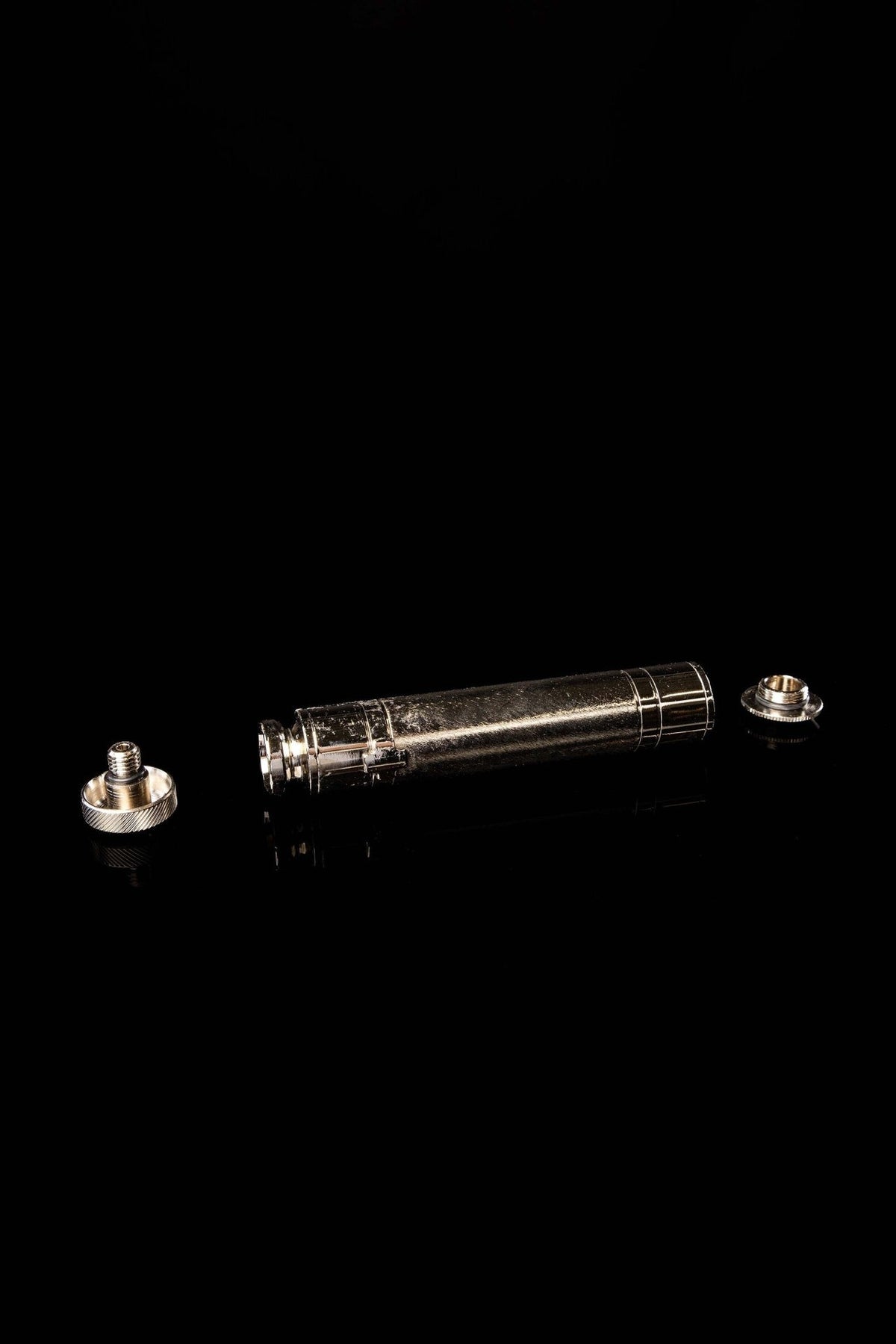 Metal aspergillum disassembled with threaded cap and base pieces