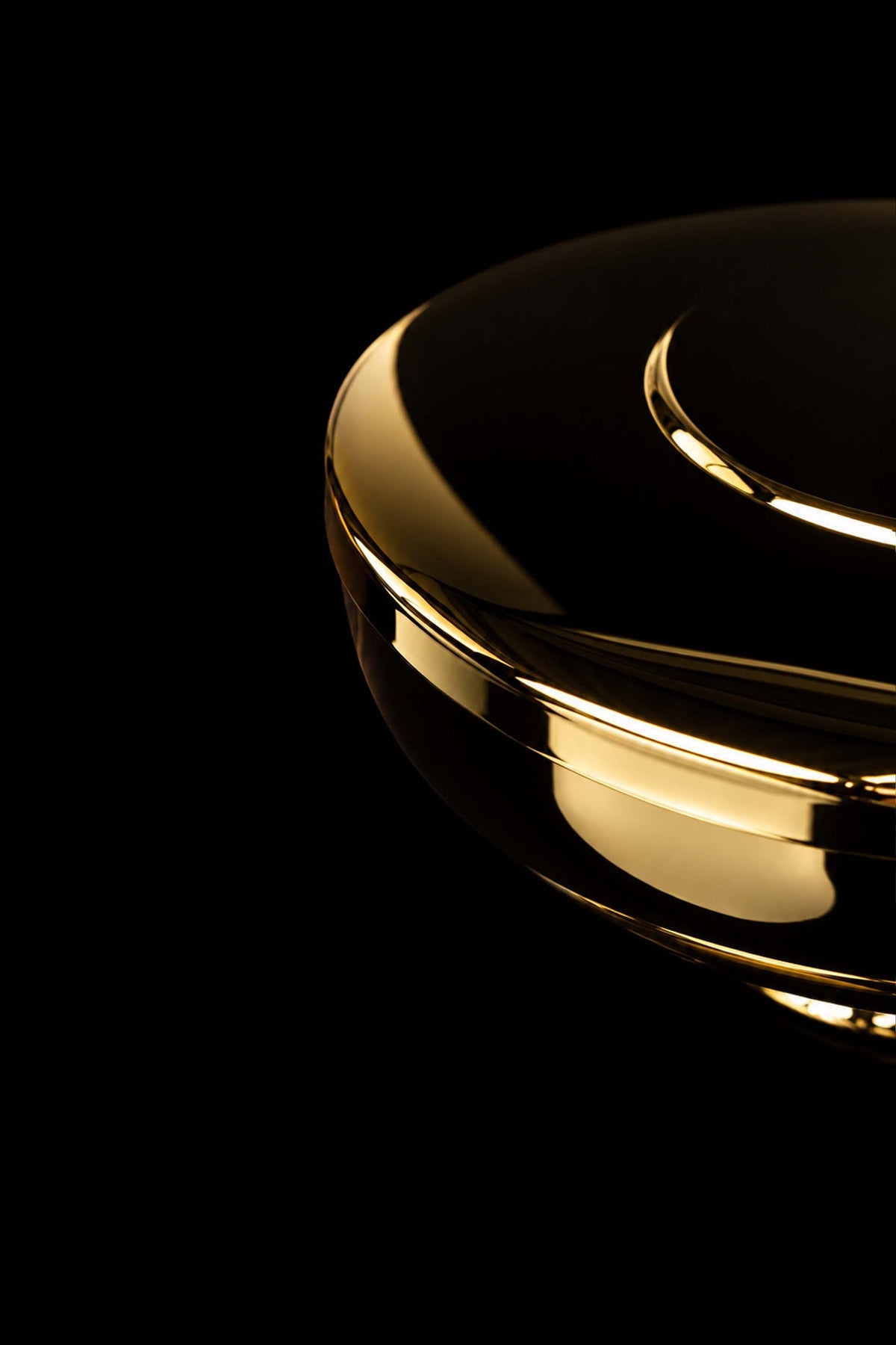 Gold-plated brass ciborium side detail showing the polished rim and smooth bowl
