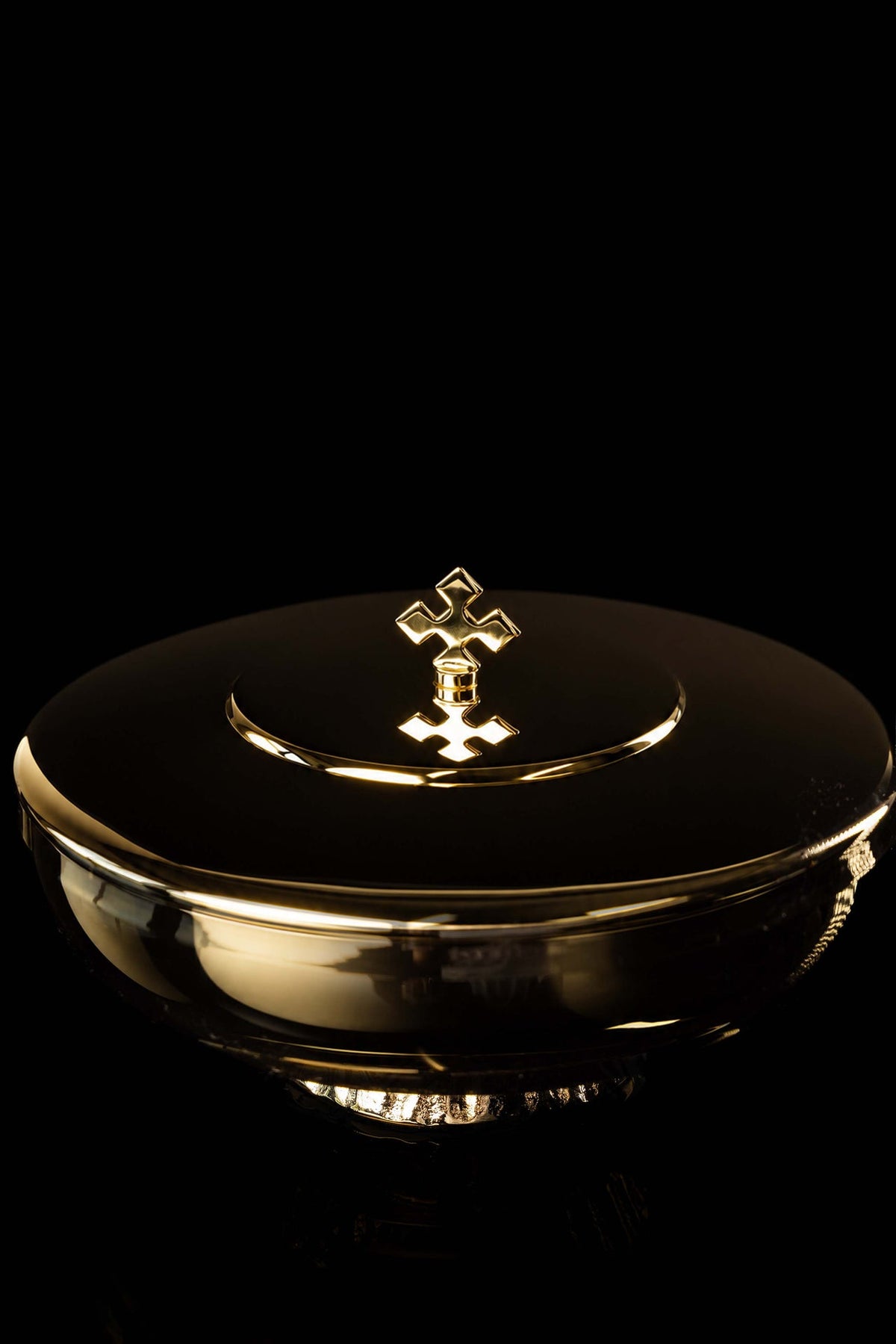 Gold-plated brass ciborium front view highlighting the cross finial and polished lid