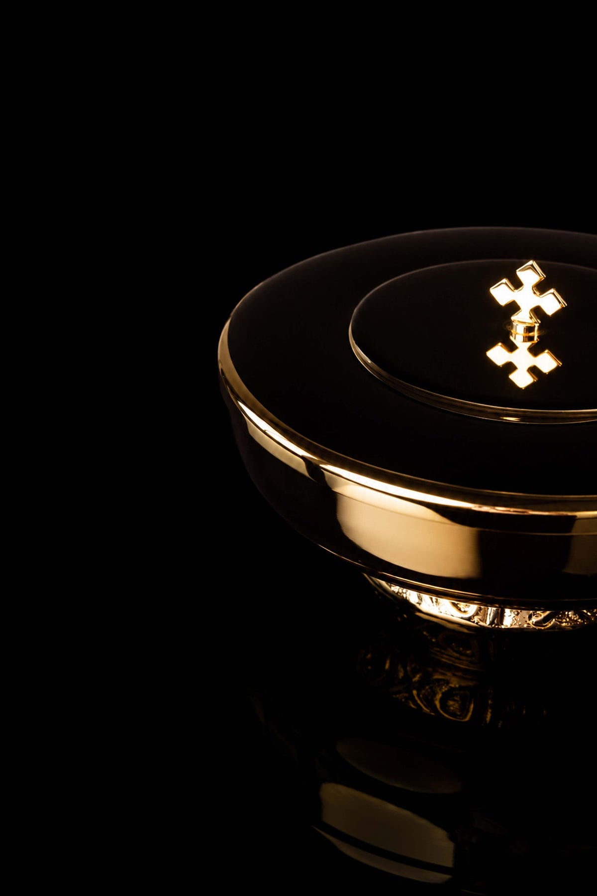 Gold-plated brass ciborium angled view highlighting the cross finial and polished lid