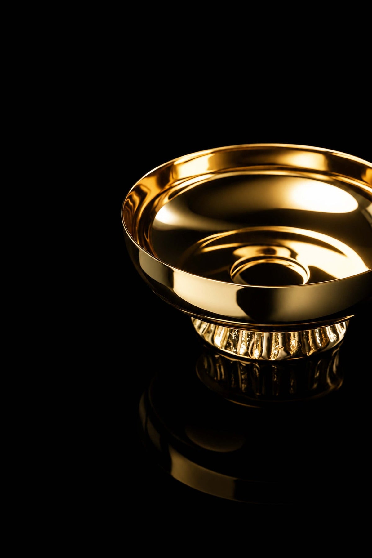 Gold-plated brass paten, angled close-up of polished basin and raised rim