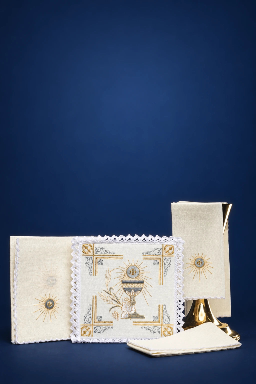 Embroidered altar linen set with chalice motif, including corporal, pall, purificator, and maniple-style cloths