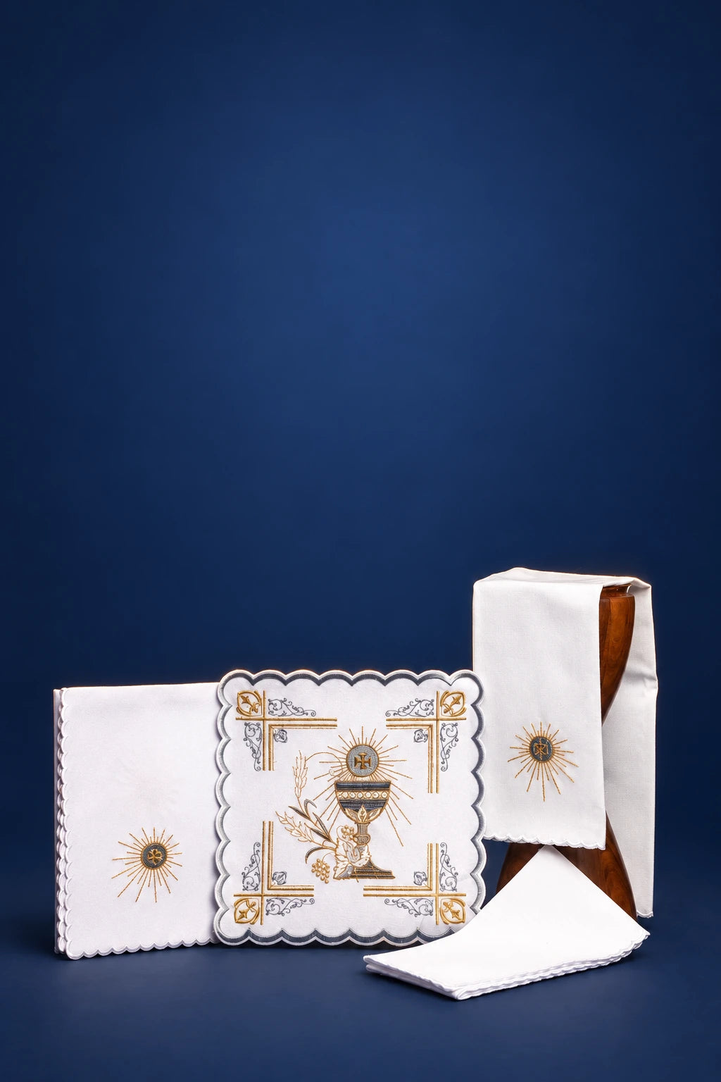 Embroidered altar linen set with purificator, pall, corporal, and lavabo towel, shown laid out front view