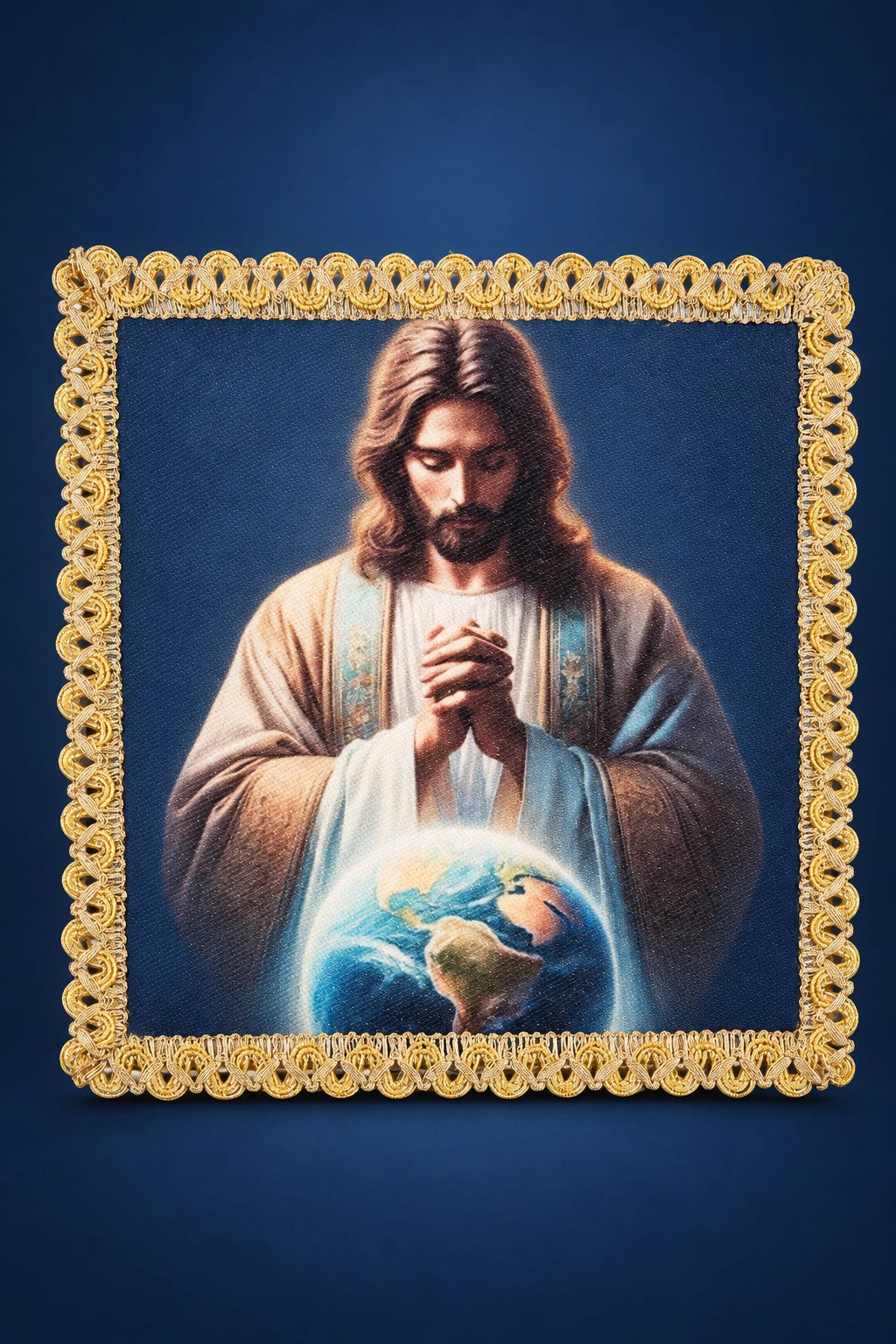 Front view of a chalice pall with Christ praying above the globe, framed by ornate gold trim