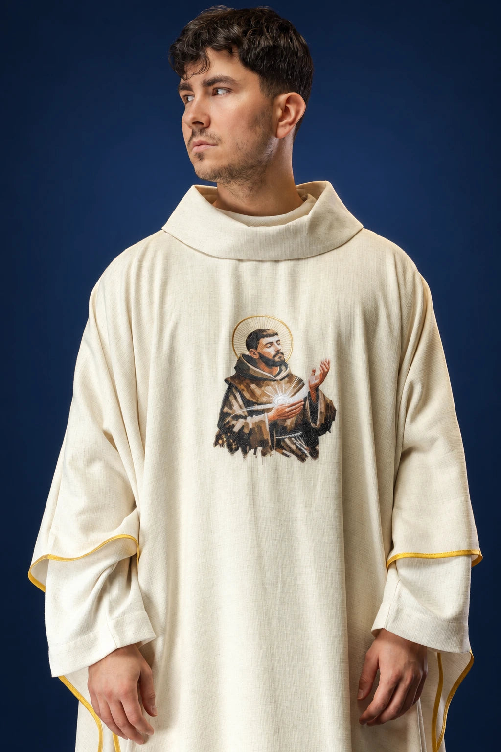 Front view of a cream chasuble with an embroidered Saint Francis image on the chest