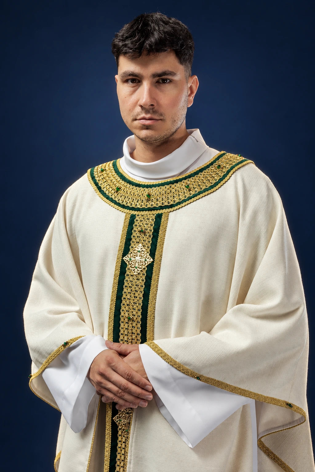 Front view of a cream chasuble with green and gold trim and a vertical gold patterned band with cross motif