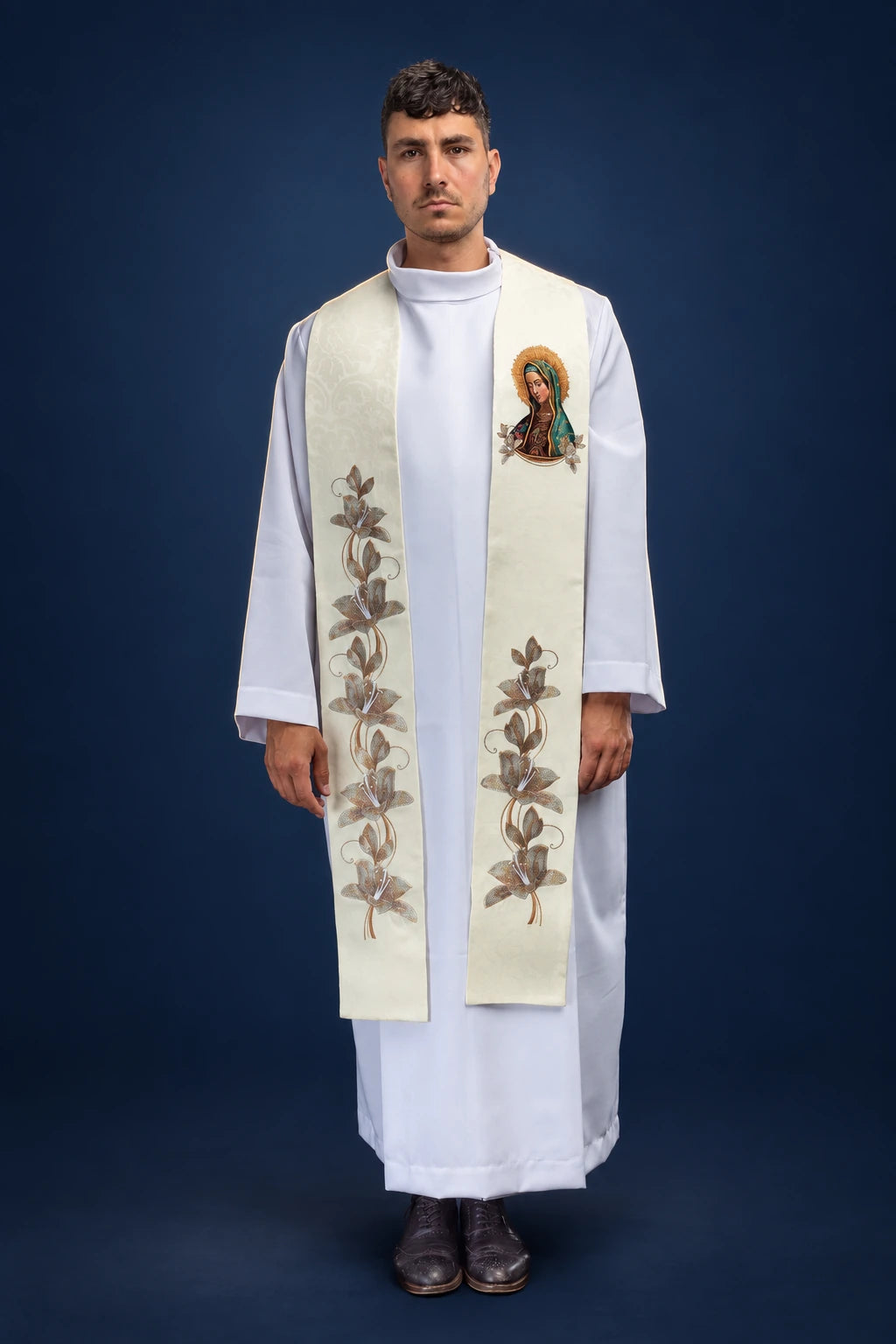 Front view of a cream stole with floral embroidery and Our Lady of Guadalupe patch detail