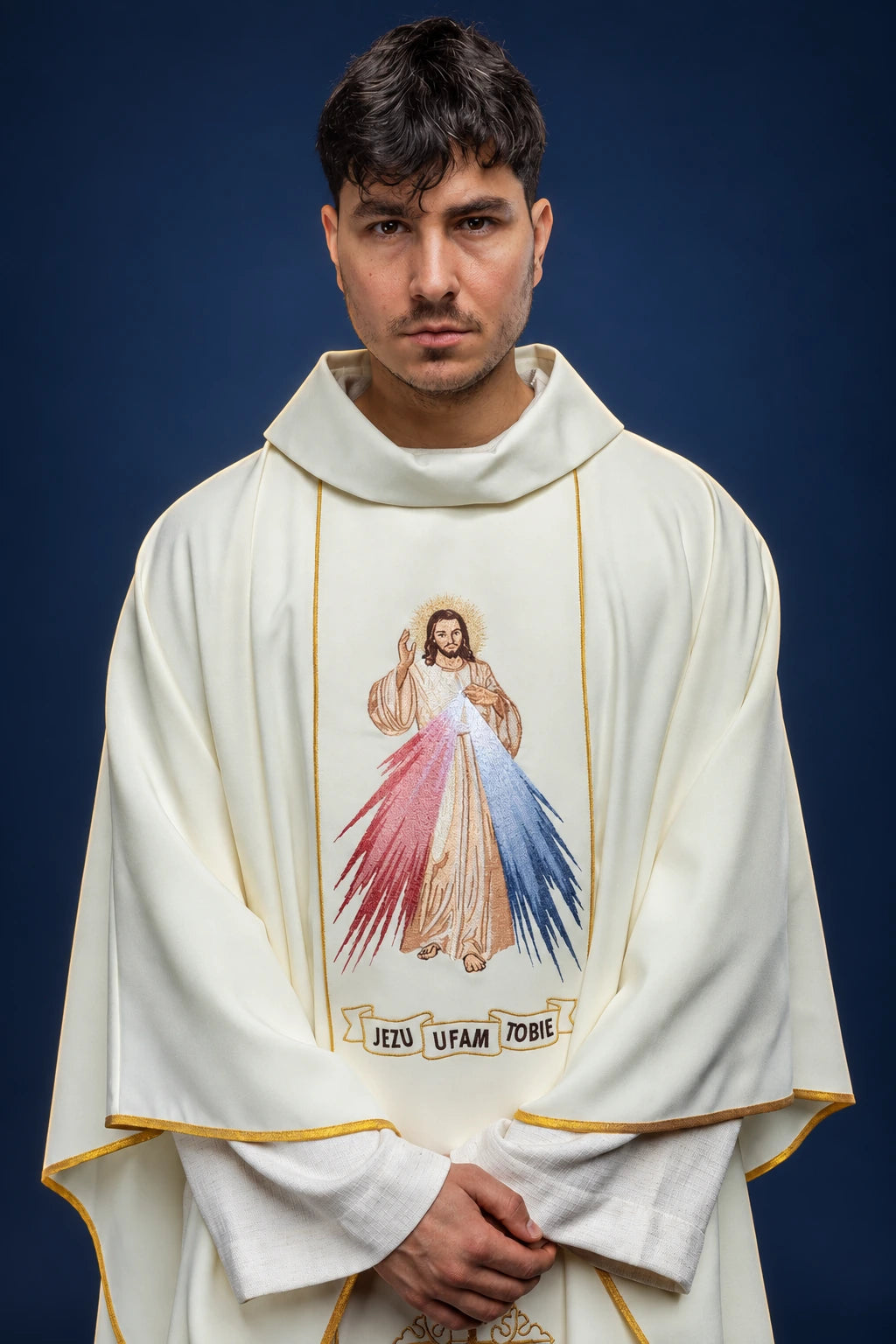 Front view of an ecru chasuble with Divine Mercy embroidery and gold trim