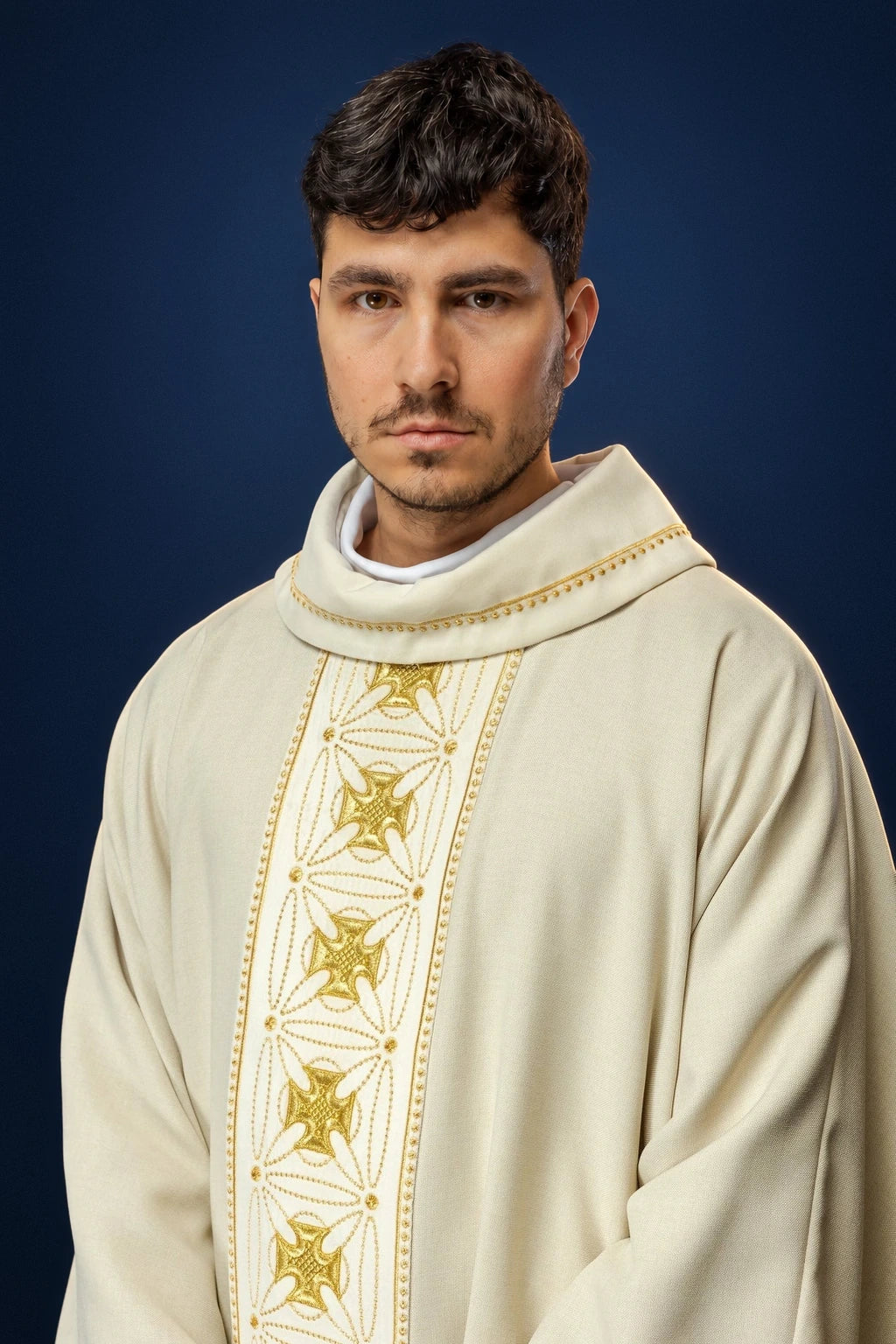 Front view of an ecru chasuble with embroidered cross-pattern orphrey down the center