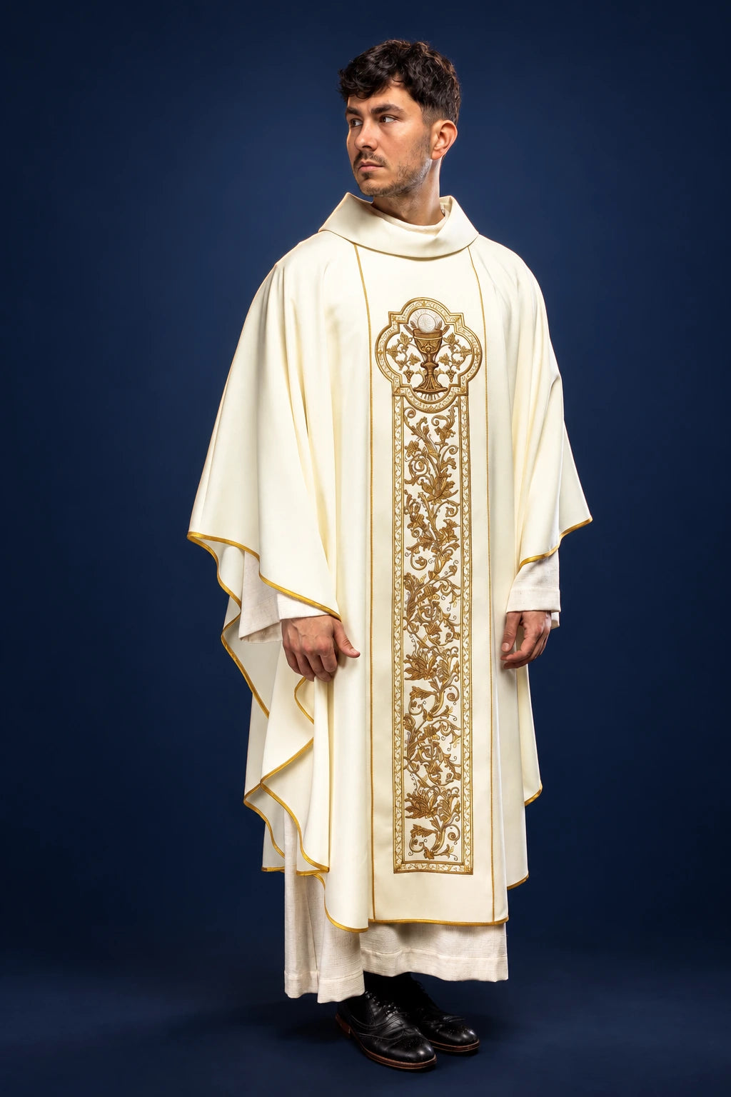 Front view of ecru chasuble with gold communion chalice embroidery and gold trim on the edges
