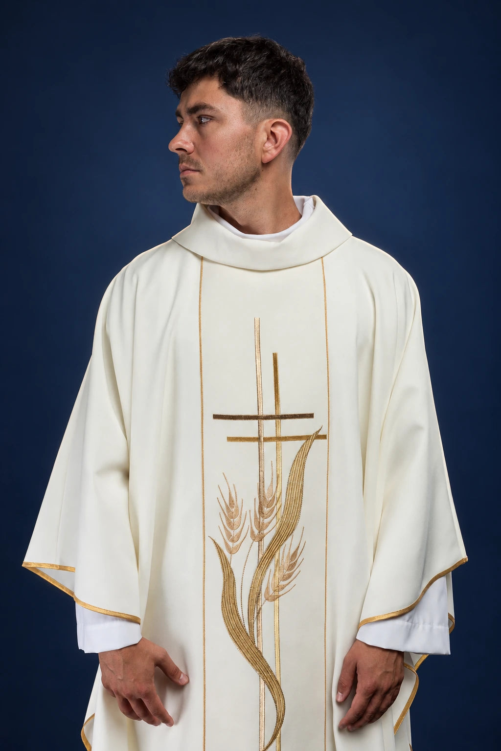 Front view of ecru chasuble with gold cross and wheat embroidery and gold-trimmed edges