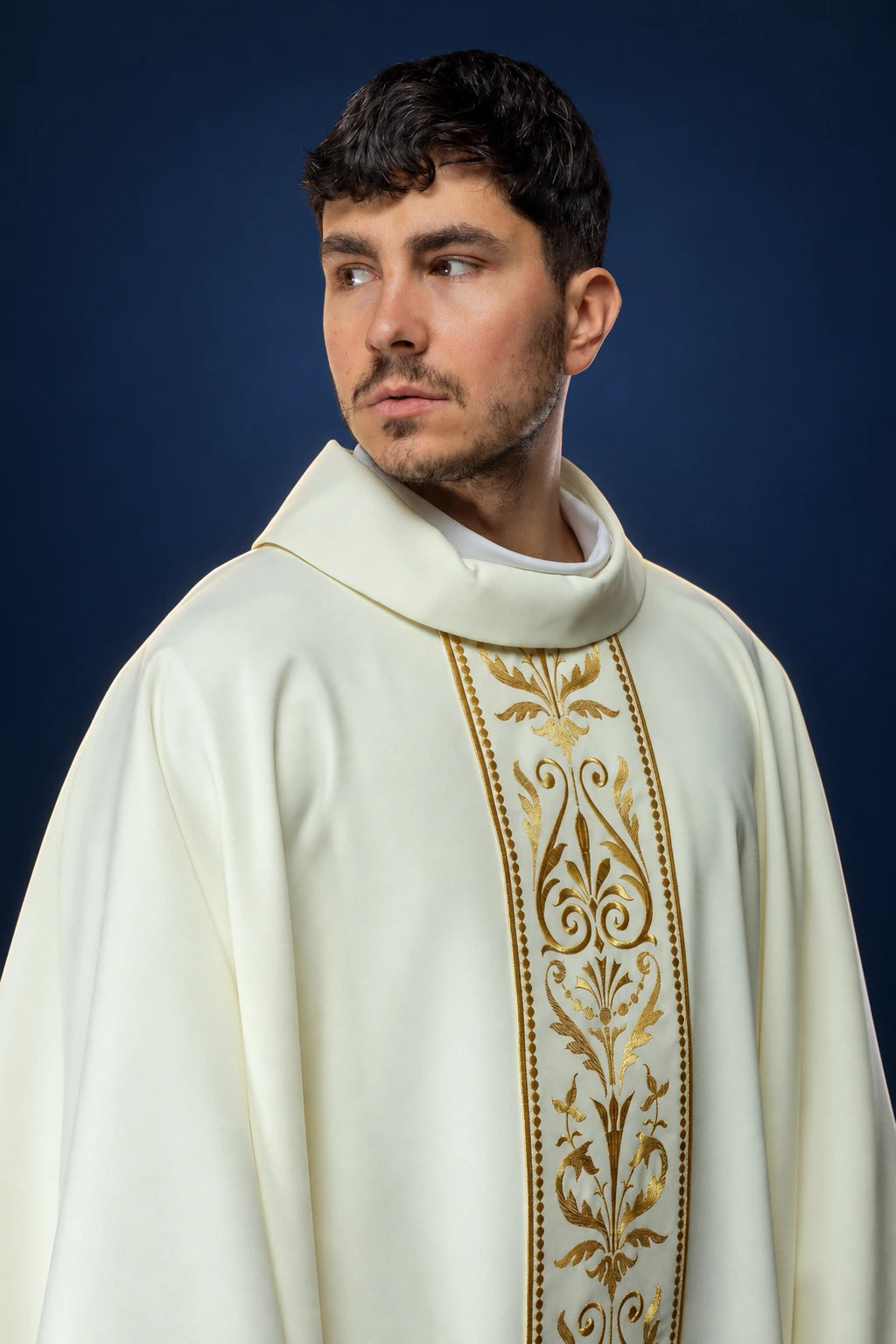 Front view of an ecru chasuble with a gold embroidered orphrey down the center front
