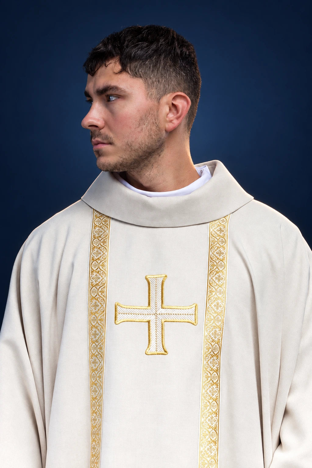 Front view of ecru chasuble with gold trim and embroidered cross on the chest