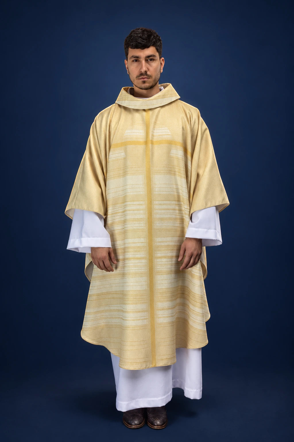 Front view of ecru chasuble with pale cross motif and wide striped panel