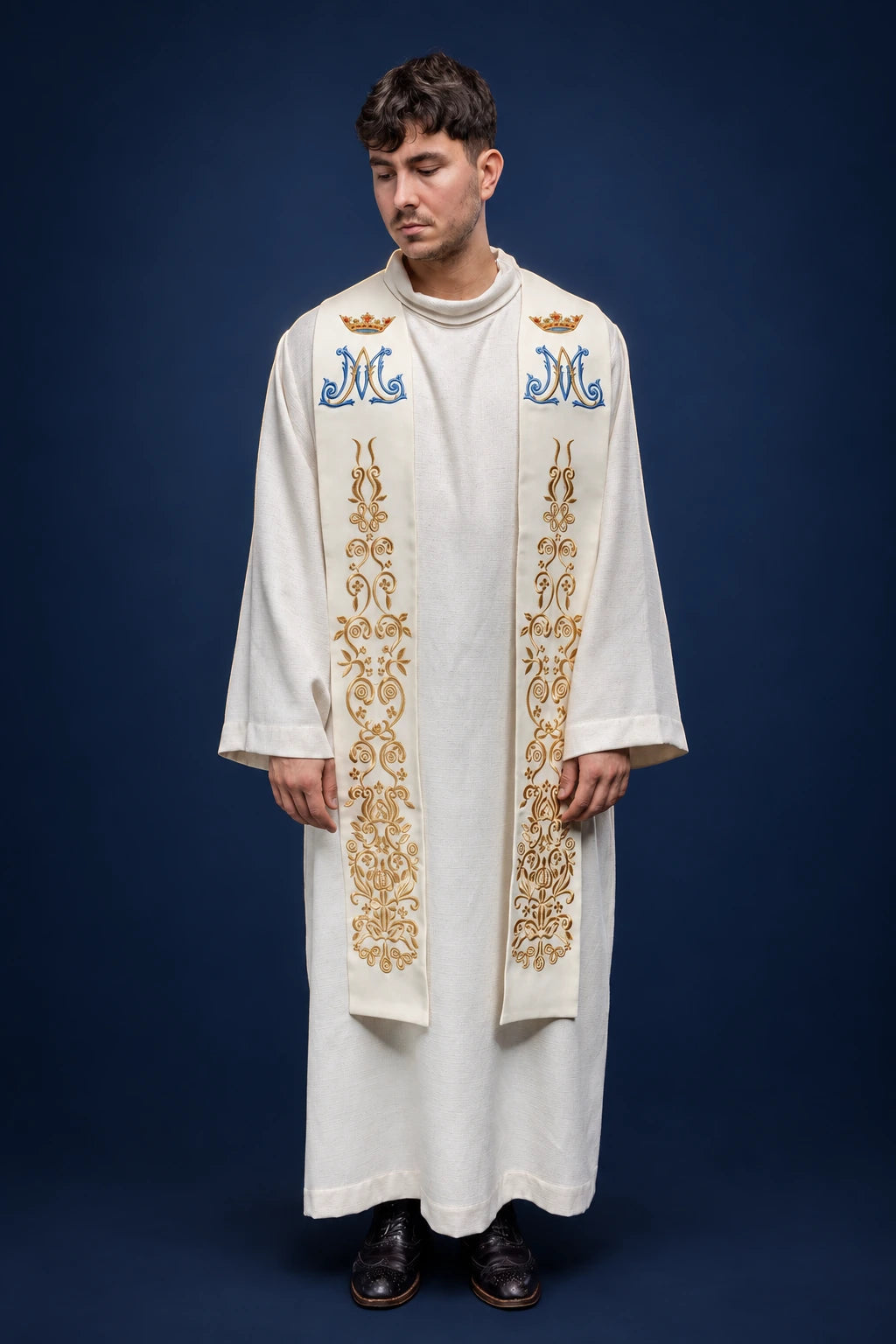 Front view of an ecru Marian stole with blue “M” monograms and gold vine embroidery
