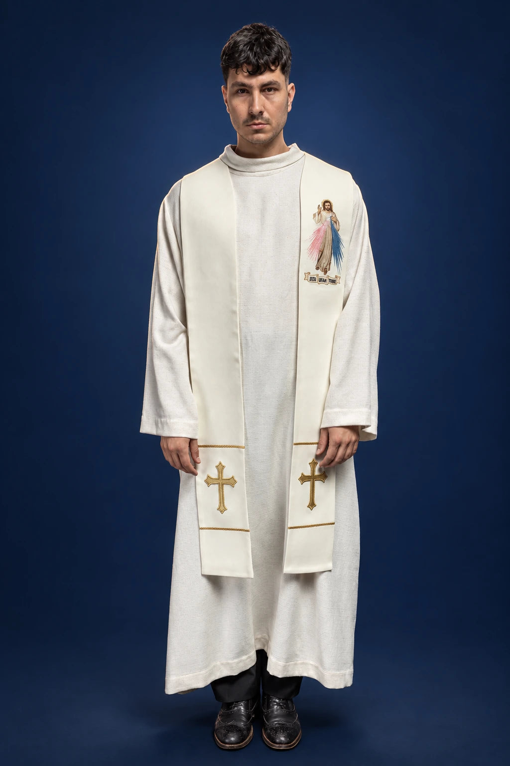 Front view of an ecru priest stole with Divine Mercy image and gold cross embroidery at the ends