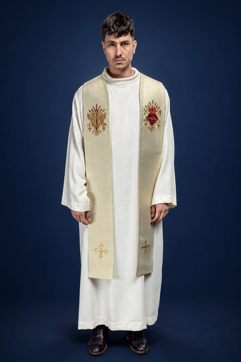 Front view of a gold priest stole with embroidered red and gold floral motifs and small crosses