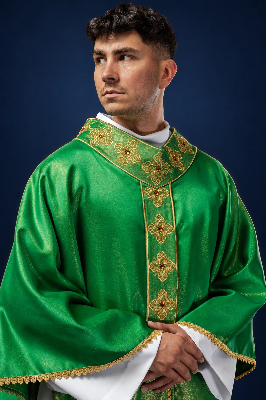 Front view of a green chasuble with embroidered gold orphrey and matching collar trim