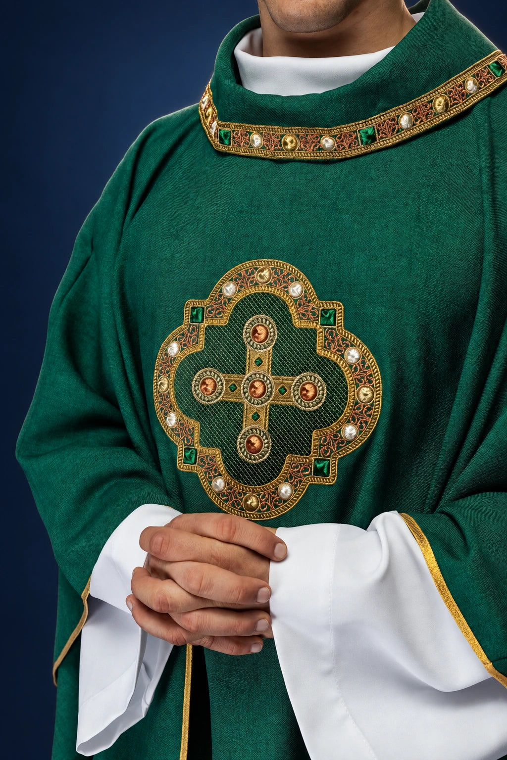 Front view of a green chasuble with embroidered trim and ornate gold cross embroidery on the chest