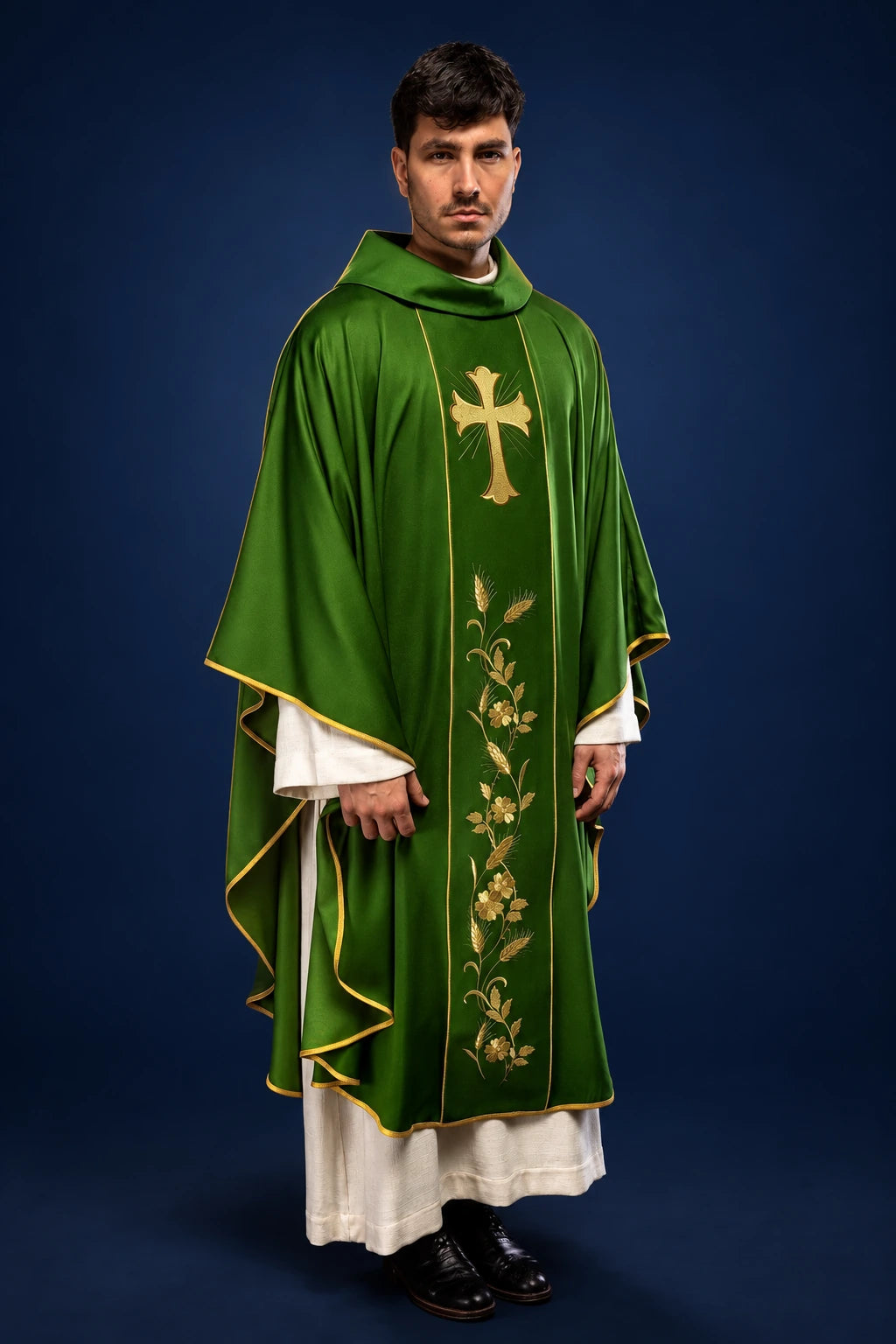 Front view of a green chasuble with gold cross and wheat embroidery, trimmed in gold