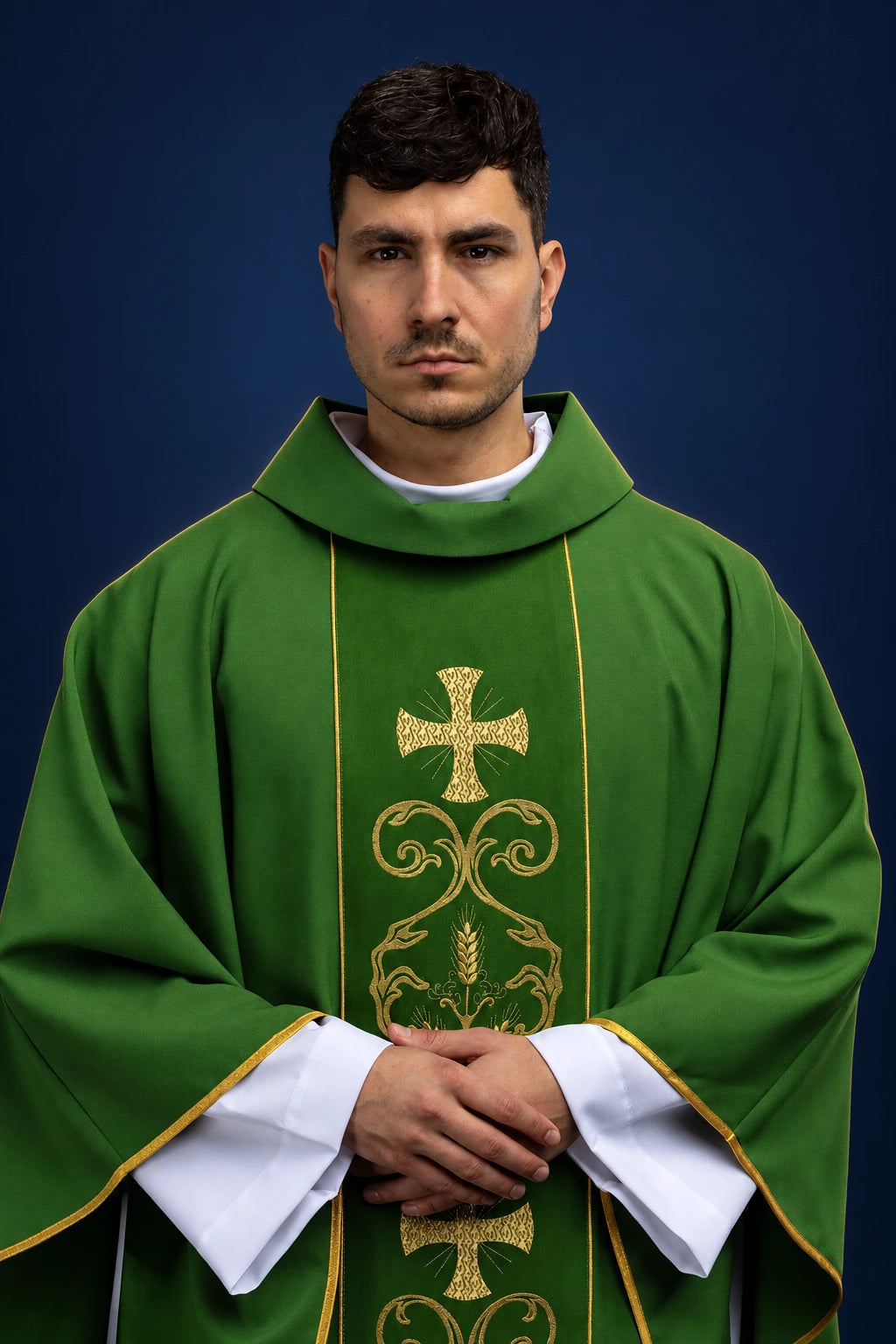 Front view of a green chasuble with a gold embroidered orphrey and cross motif.