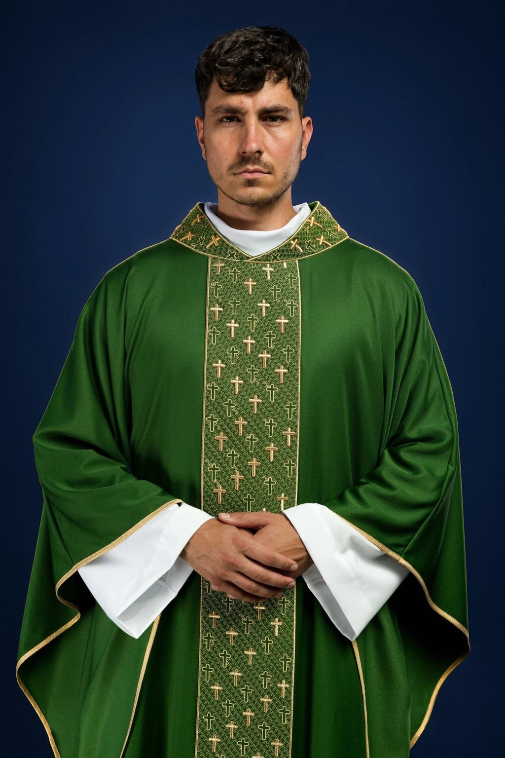 Front view of a green chasuble with gold trim and a cross-patterned embroidered orphrey panel.