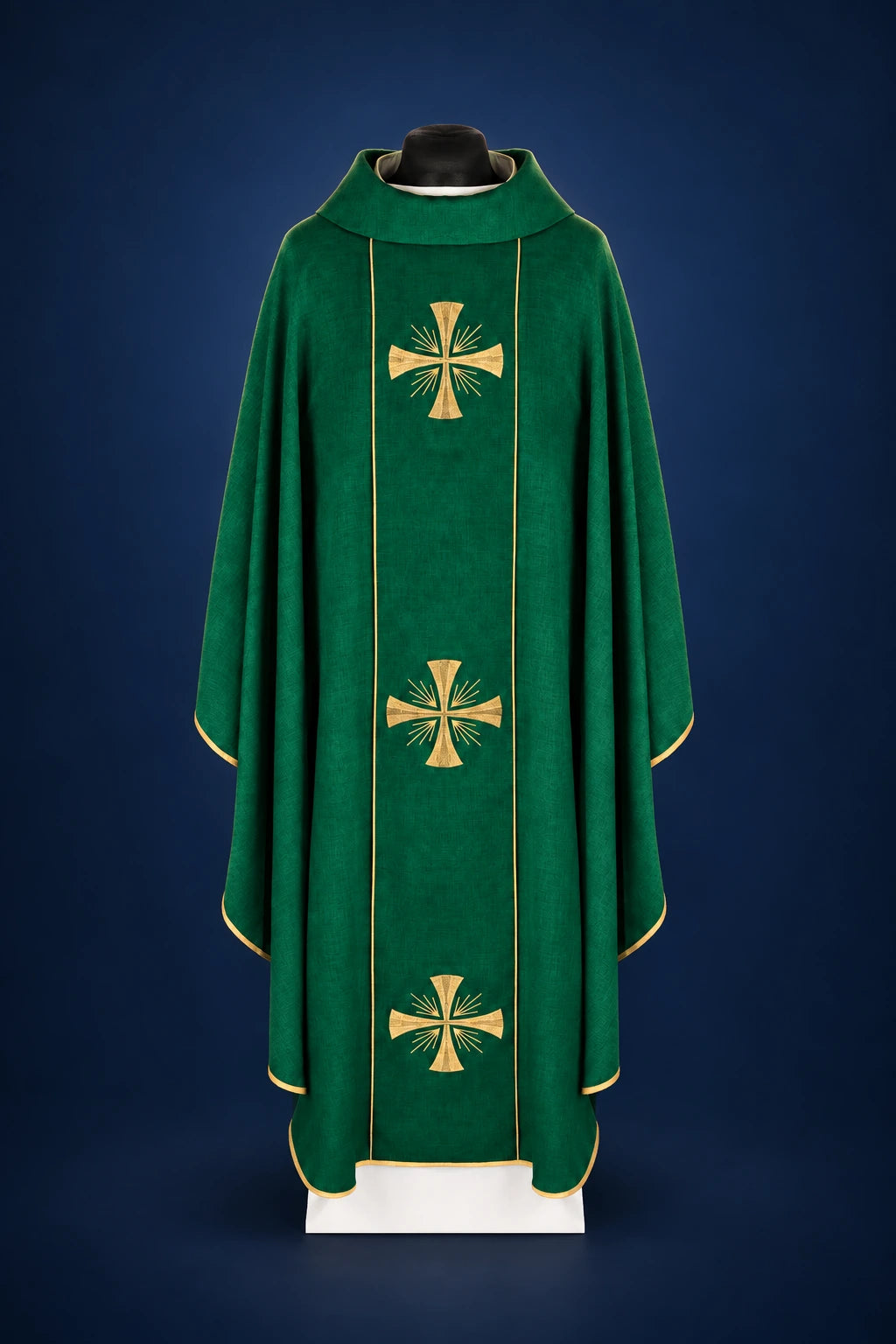 Front view of a green chasuble with gold trim and three embroidered crosses