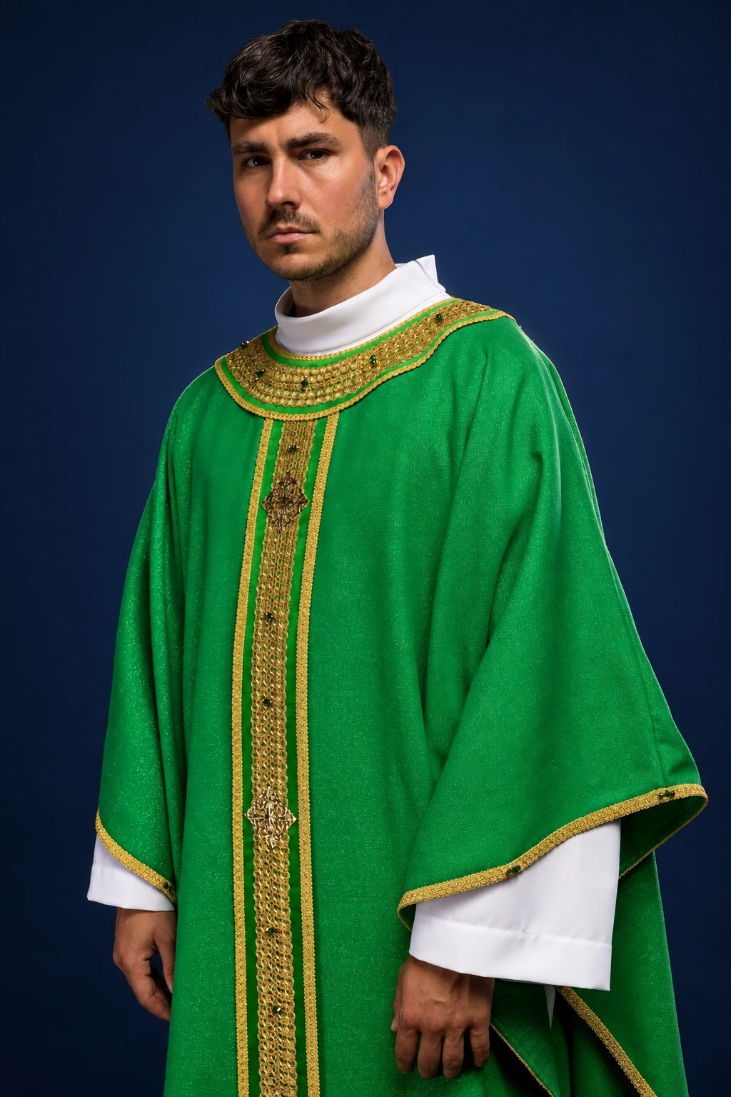 Front view of a green chasuble with gold trim, vertical orphrey, and stone detailing around the neckline.