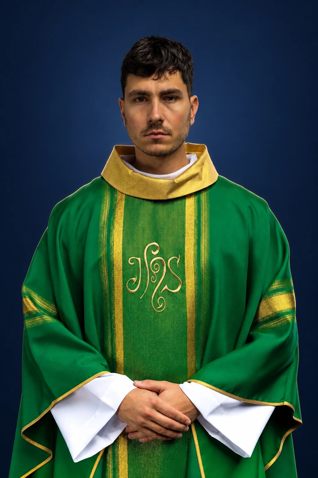 Front view of a green chasuble with gold trim, vertical gold panel, and embroidered IHS monogram on the chest
