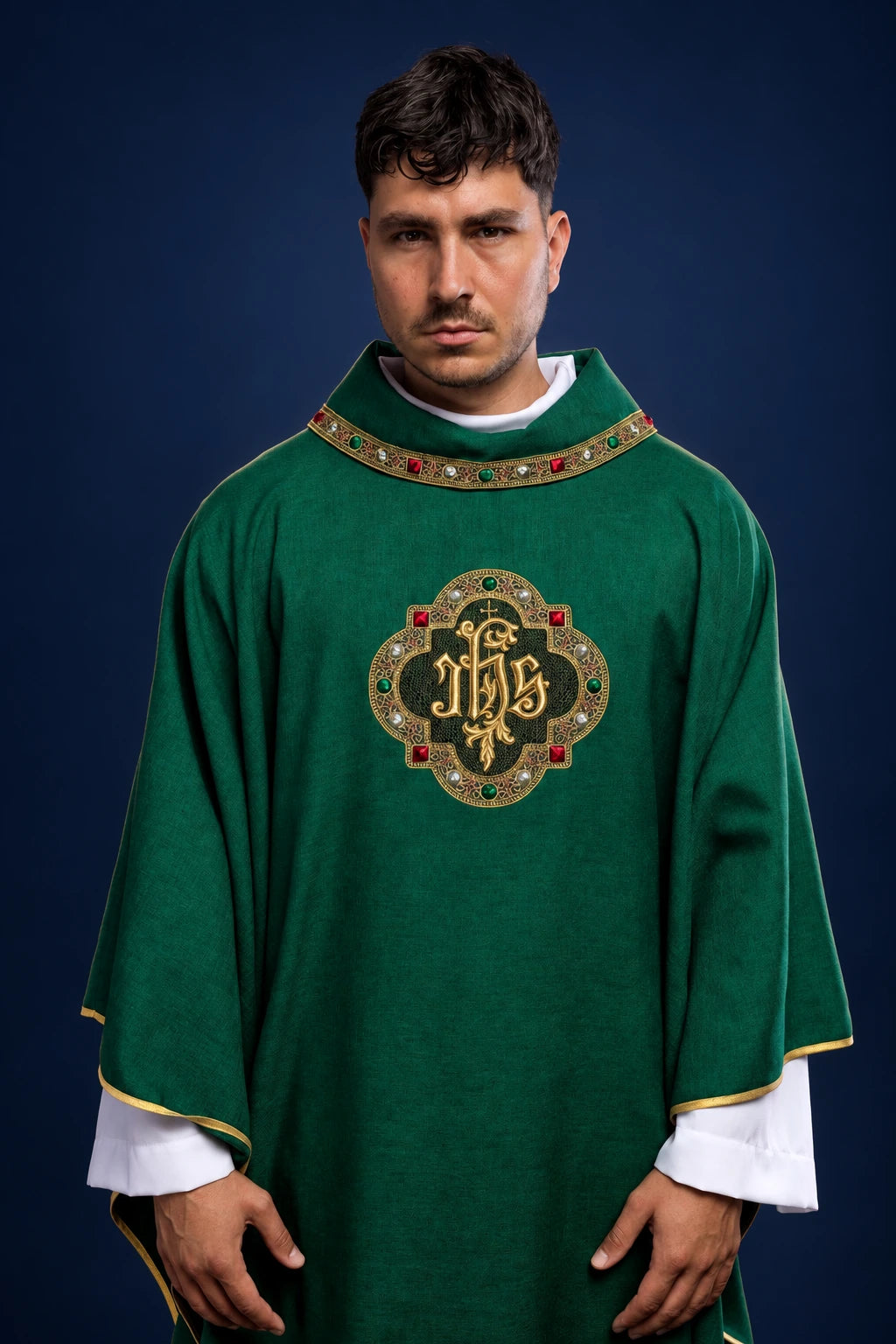 Front view of green chasuble with IHS embroidery and gold-trimmed collar and sleeves
