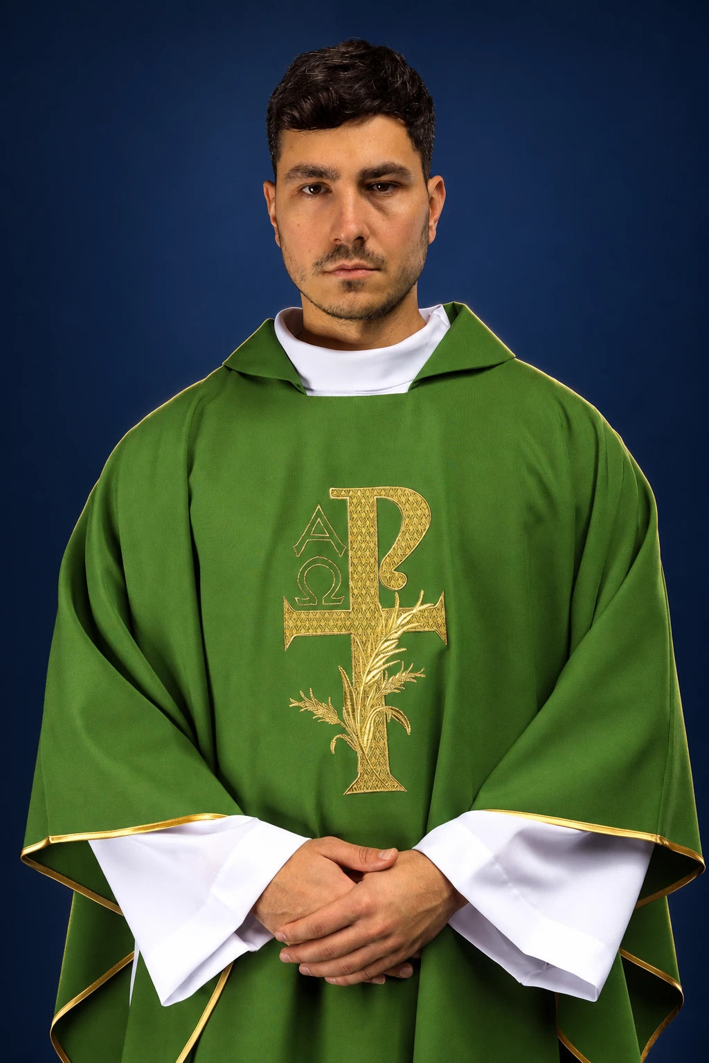 Front view of green chasuble with wide collar and gold Alpha Omega embroidery on the chest