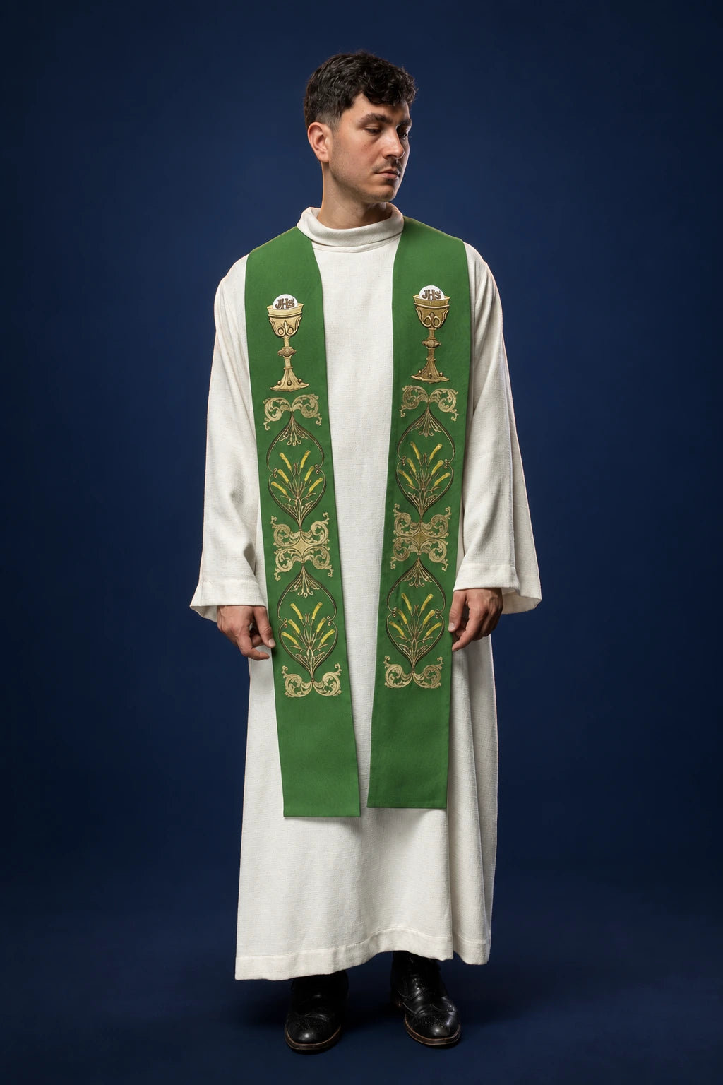 Front view of a green priest stole with chalice and wheat embroidery, worn over a white alb